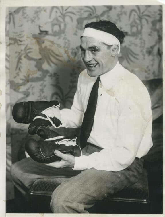 Tommy Loughran Holding Boxing Gloves Wallpaper