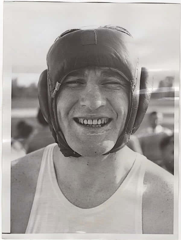 Tommy Loughran Smiling With Protective Headgear Wallpaper