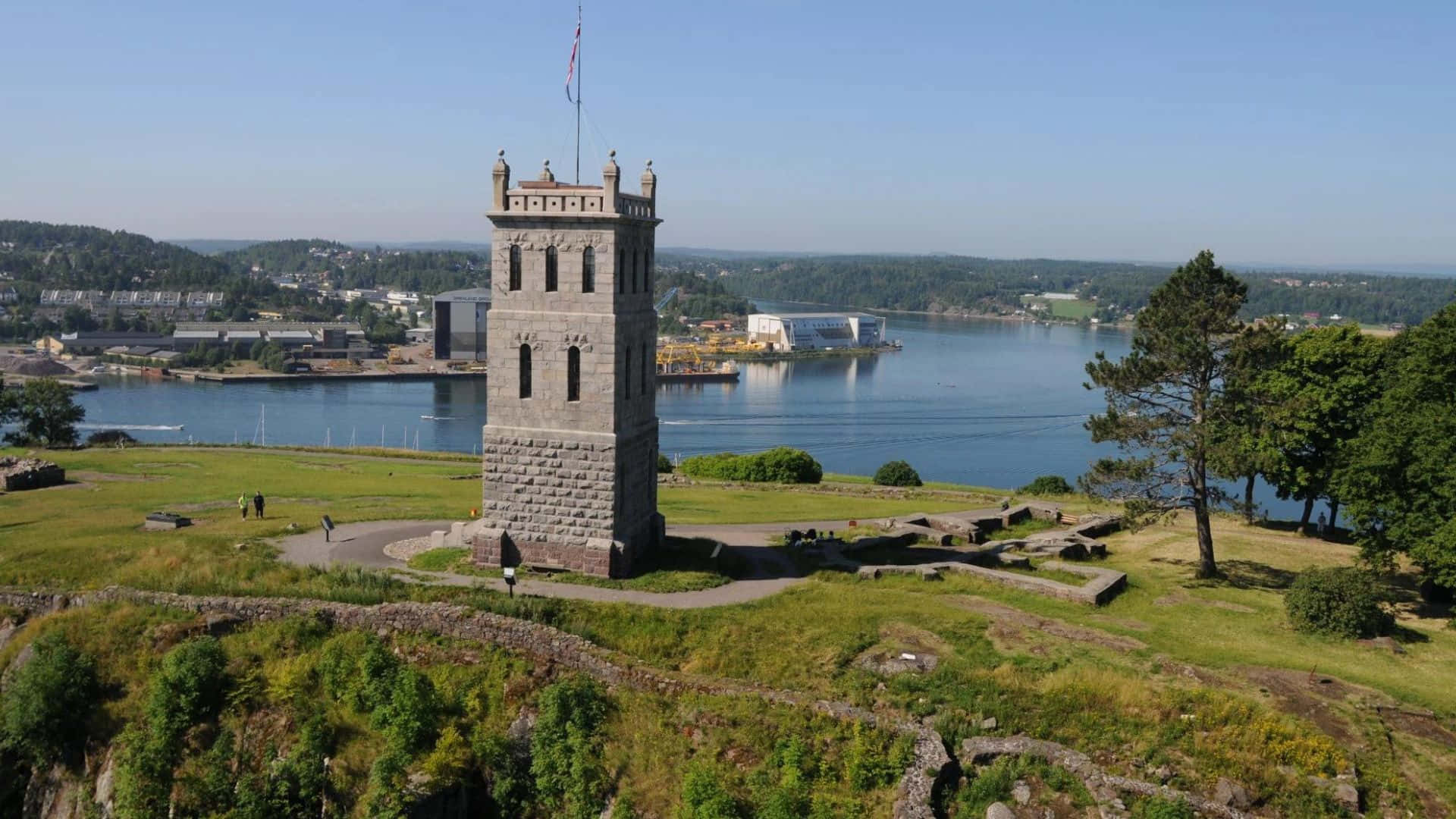 Download Tonsberg Tower Overlooking Waterfront Wallpaper | Wallpapers.com