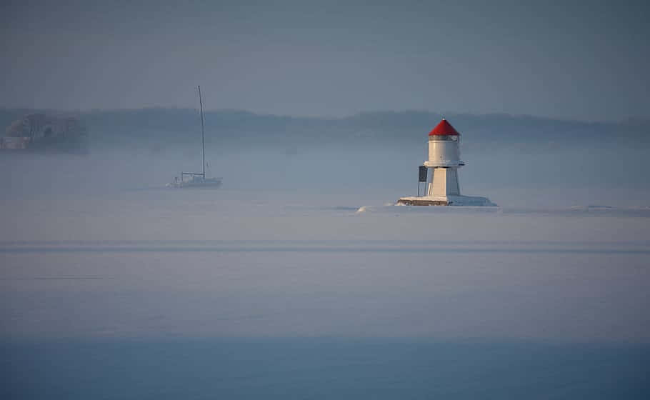 Tonsberg Winter Lighthouseand Sailboat Wallpaper