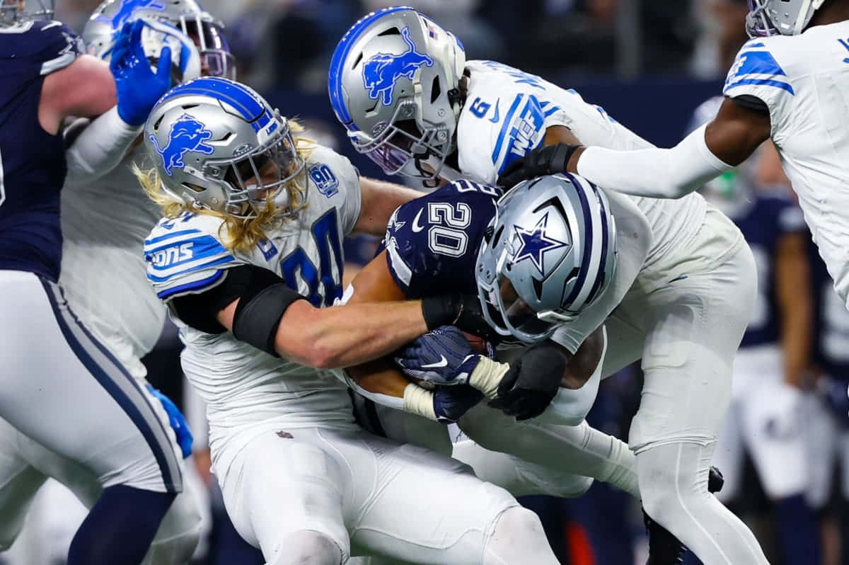 Tony Pollard Taclée Par La Défense Des Lions Fond d'écran