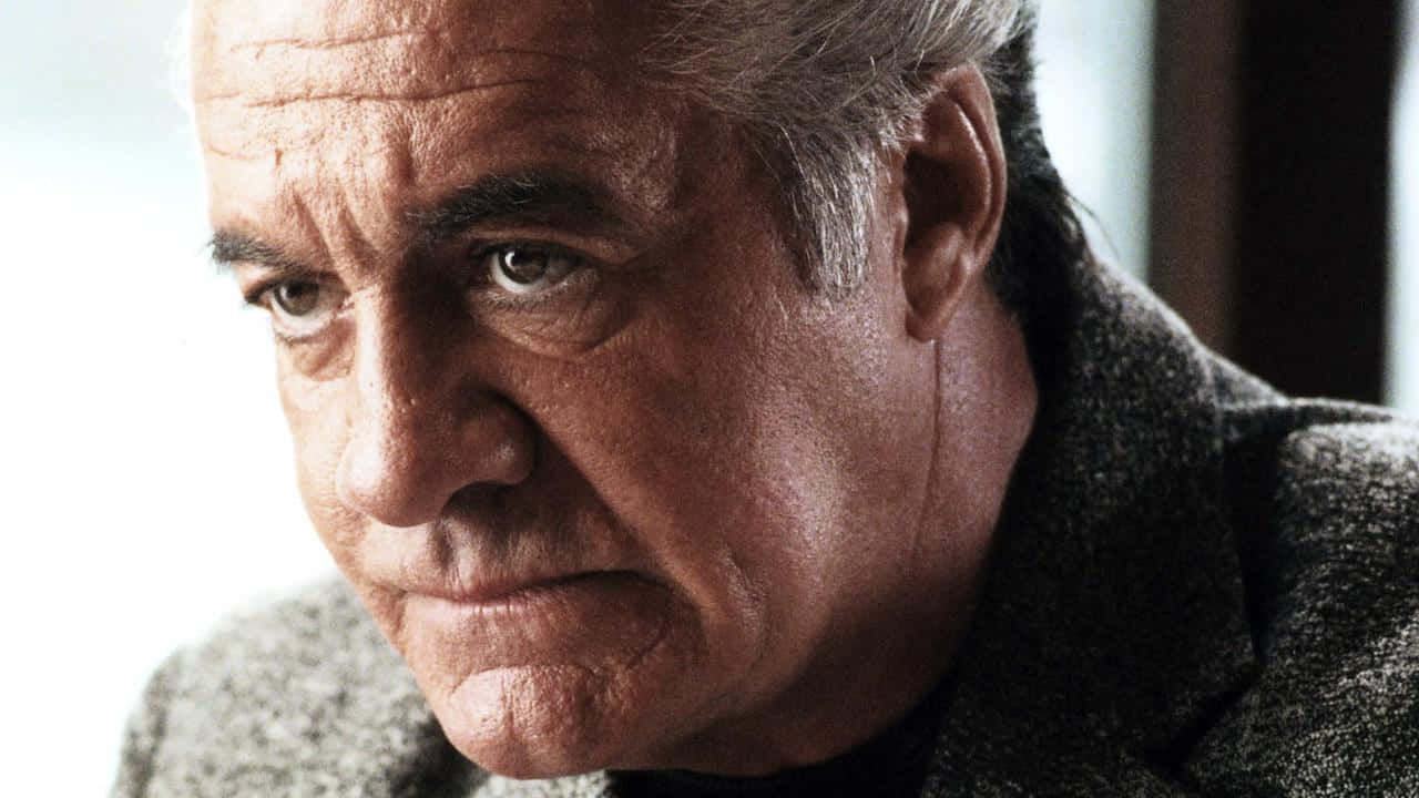 Tony Sirico striking a pose in a dapper suit. Wallpaper