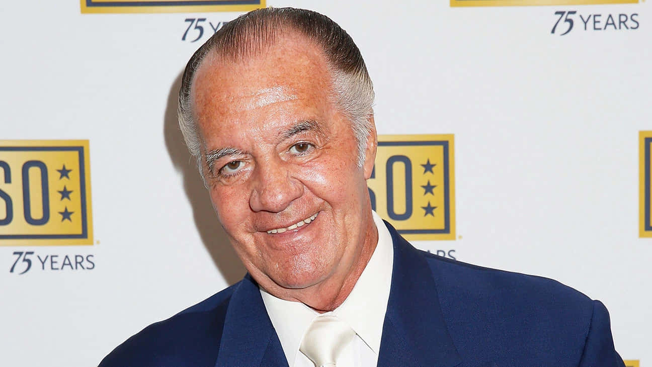 Caption: Tony Sirico striking a pose in a suit Wallpaper