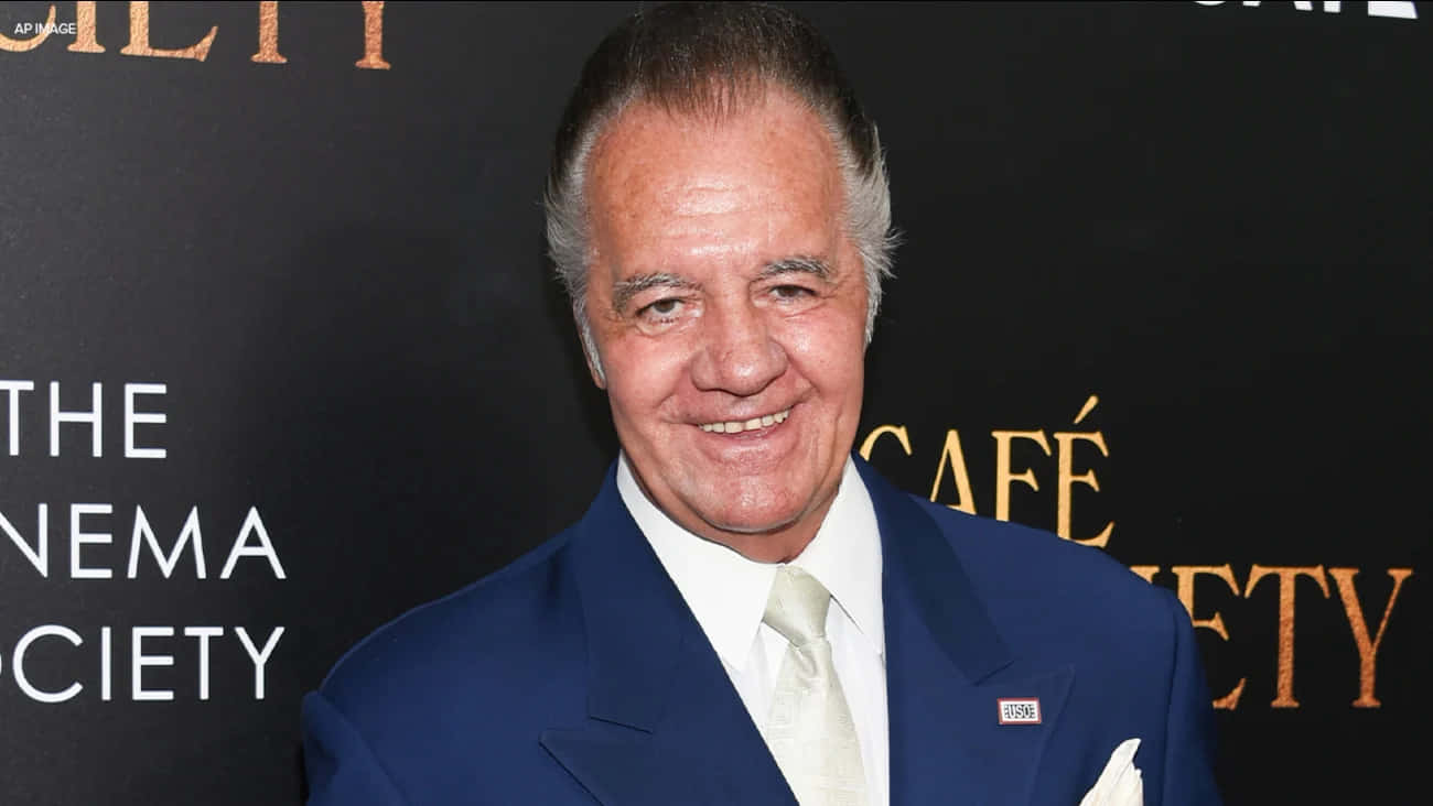 Tony Sirico strikes a pose in a fashionable suit. Wallpaper