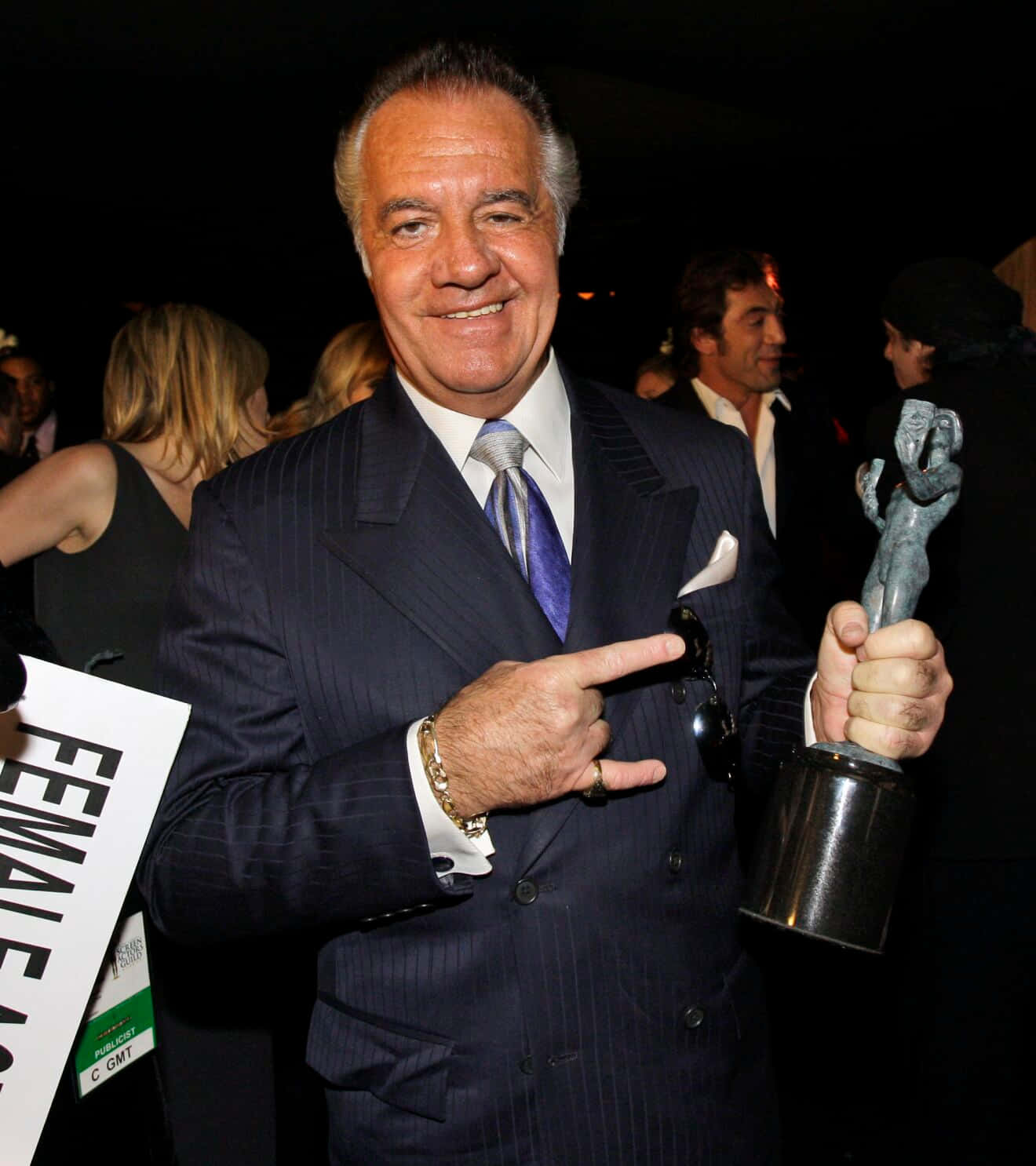 Tony Sirico striking a pose in a suit Wallpaper