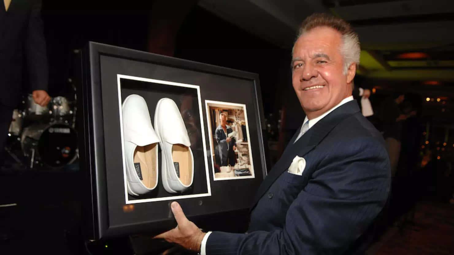 Tony Sirico exuding confidence in a stylish suit Wallpaper