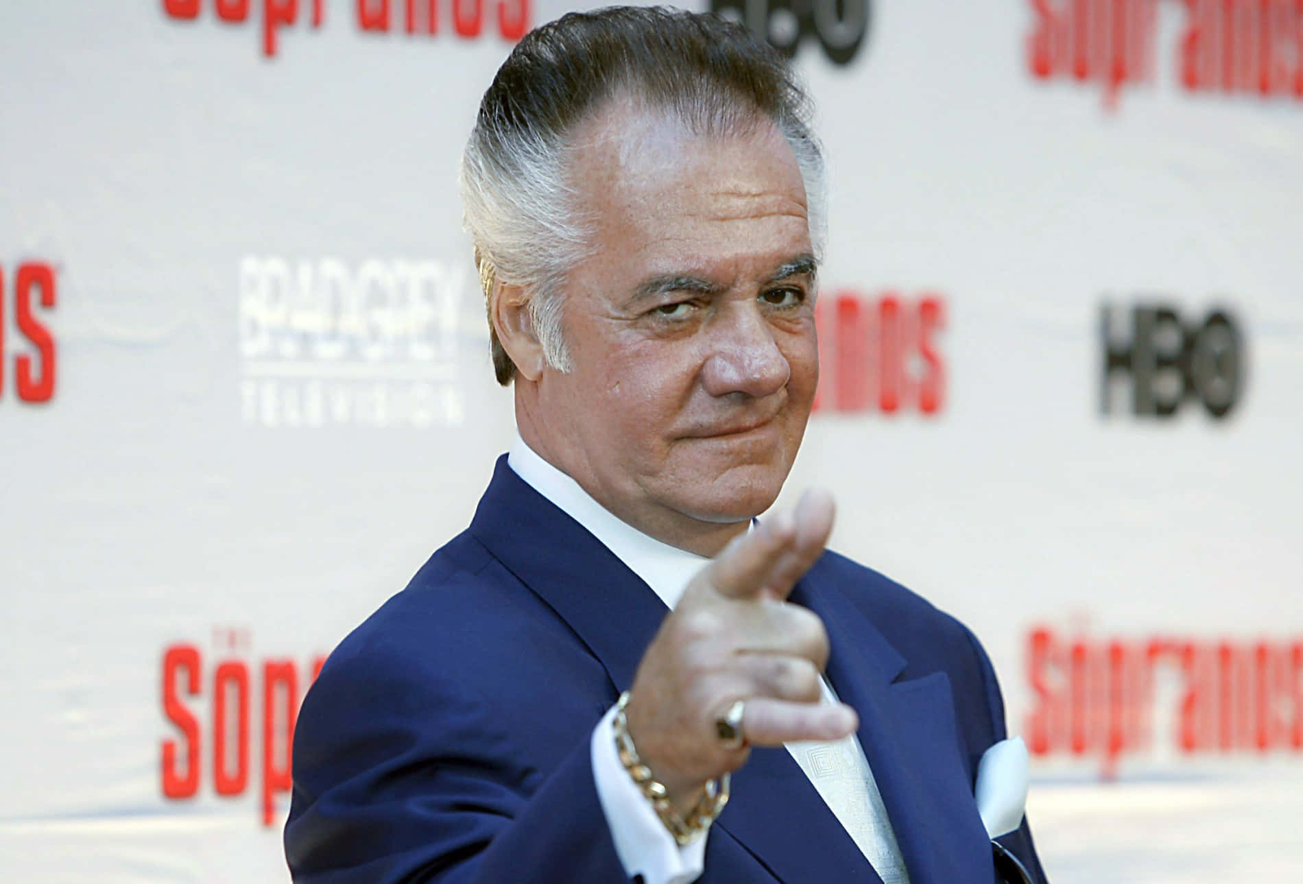 Tony Sirico striking a pose in a suit Wallpaper
