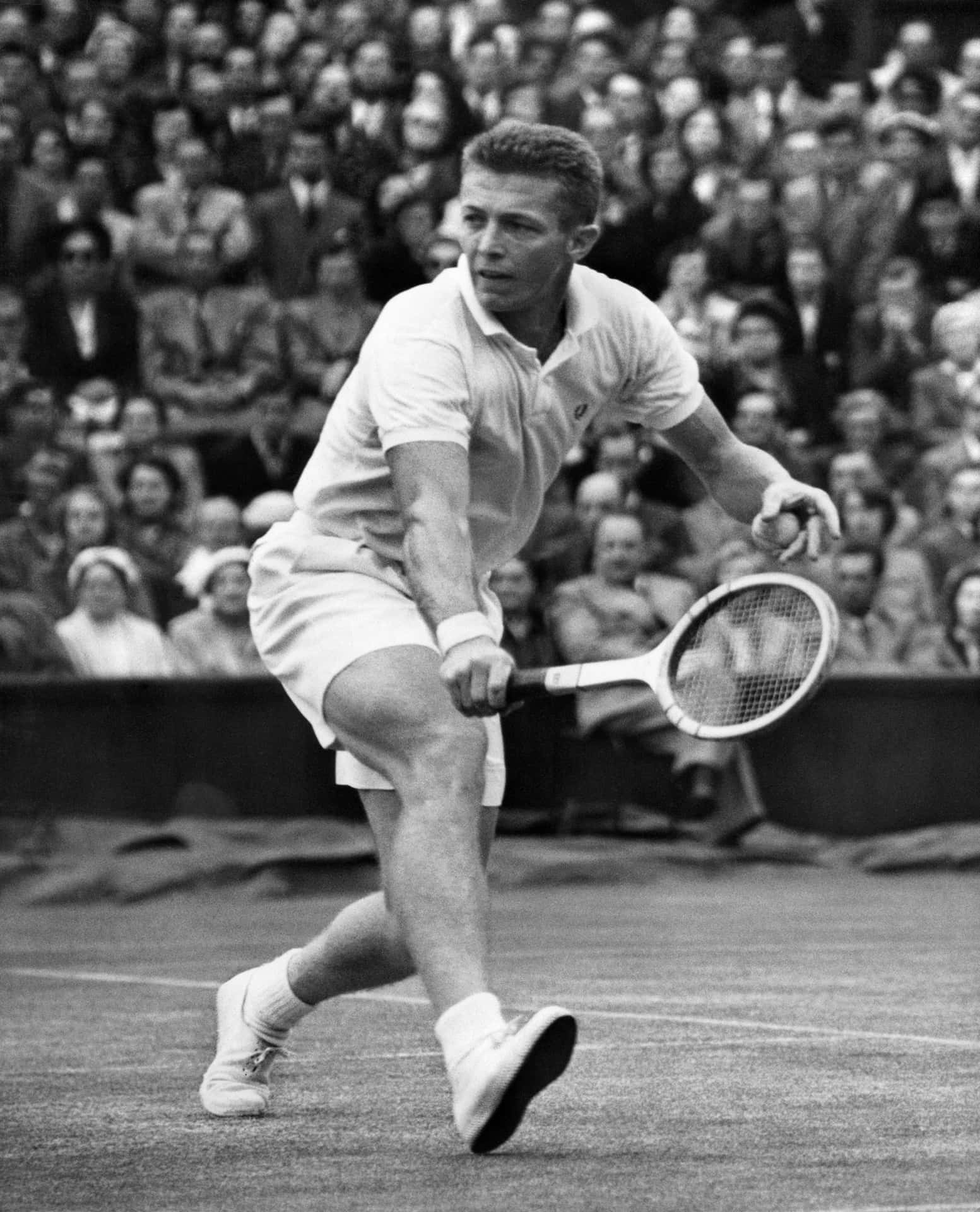 Tony Trabert in action at the 1954 Wimbledon Finals Wallpaper