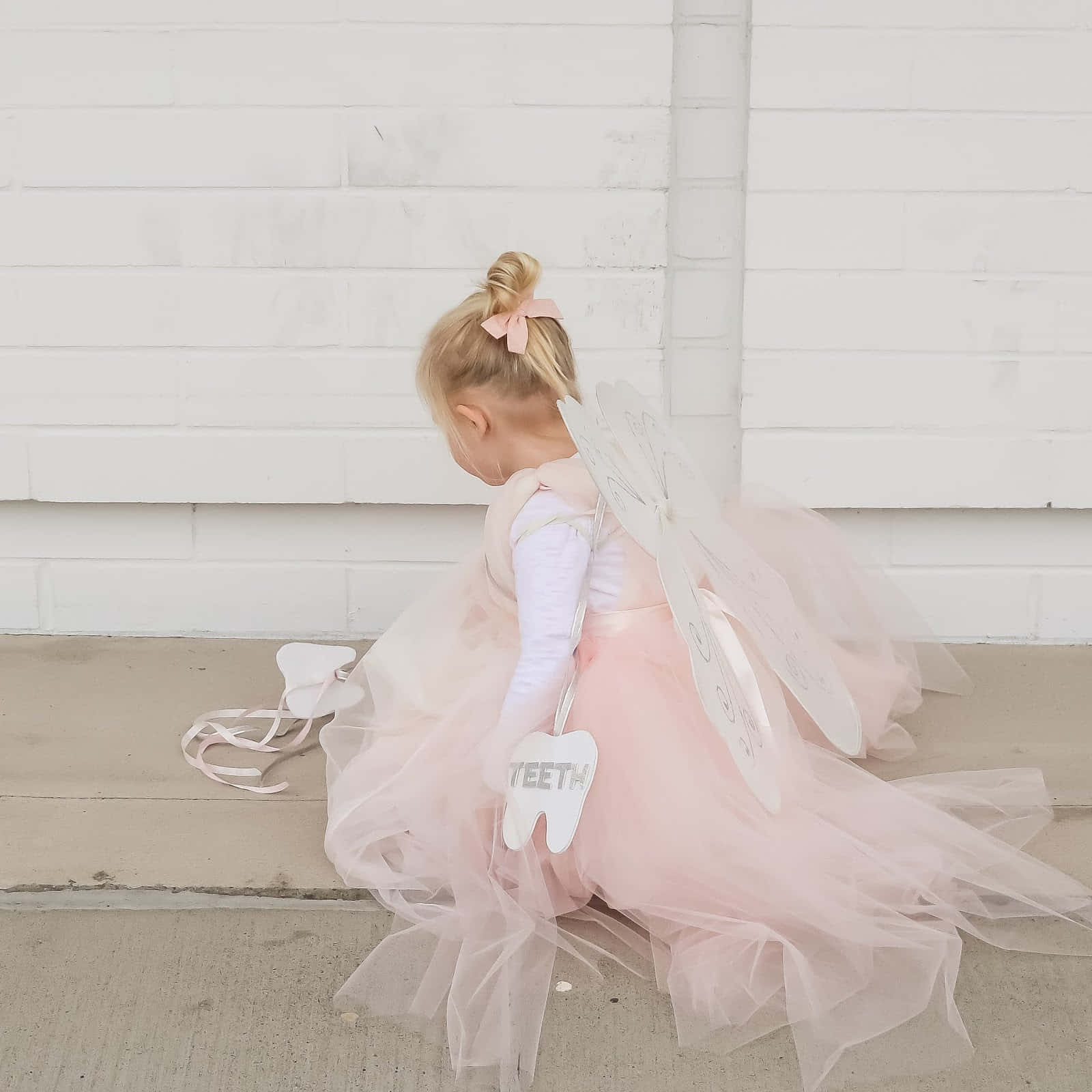 A Little Girl Dressed Up In A Pink Tutu