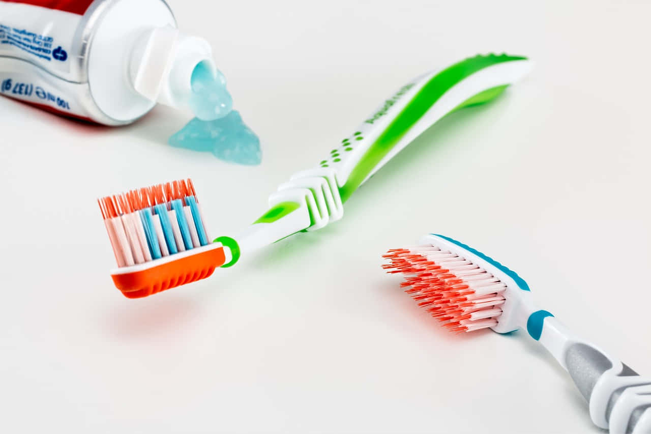 Toothbrushand Toothpaste Setup Wallpaper