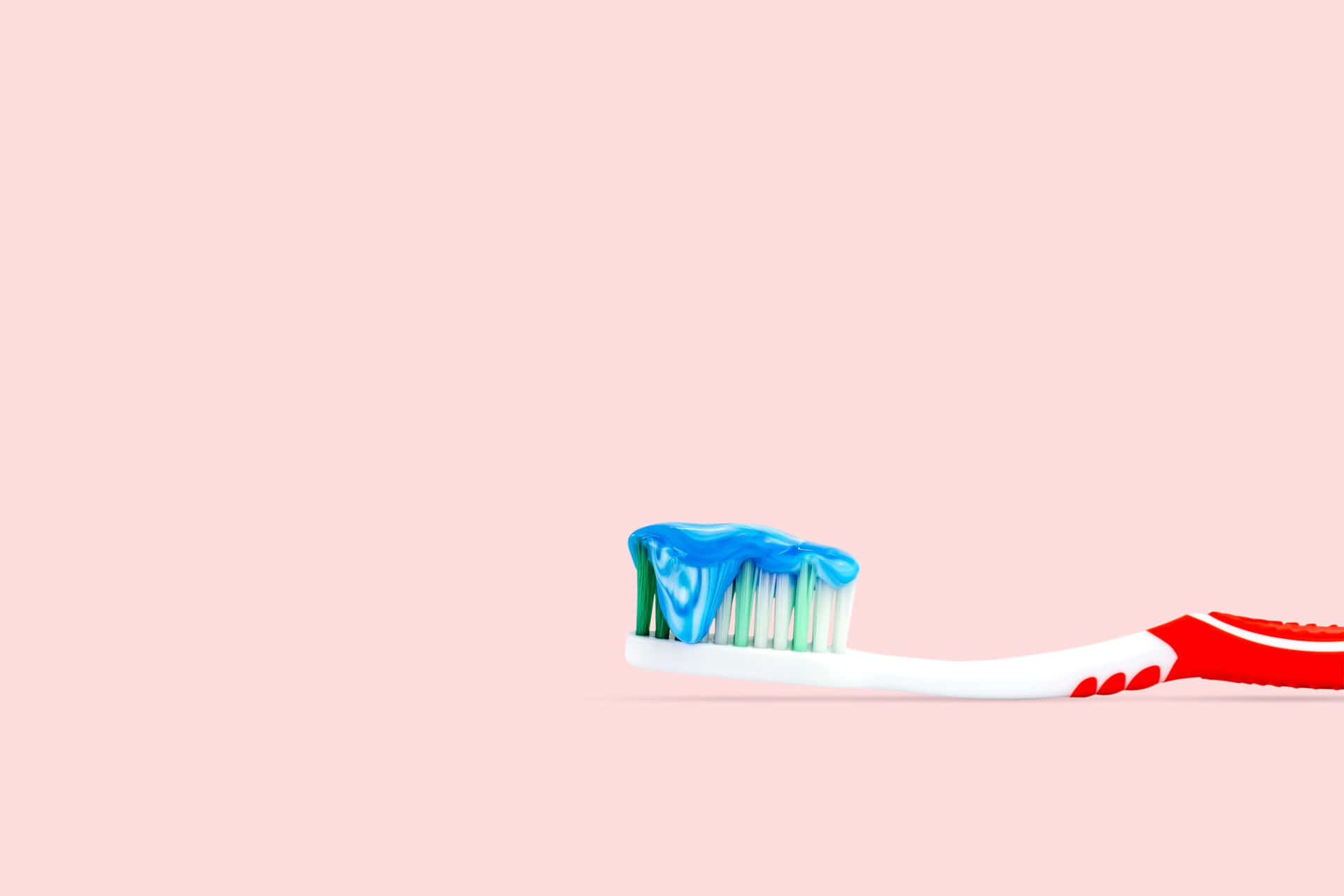 Toothbrushwith Blue Toothpaste Wallpaper