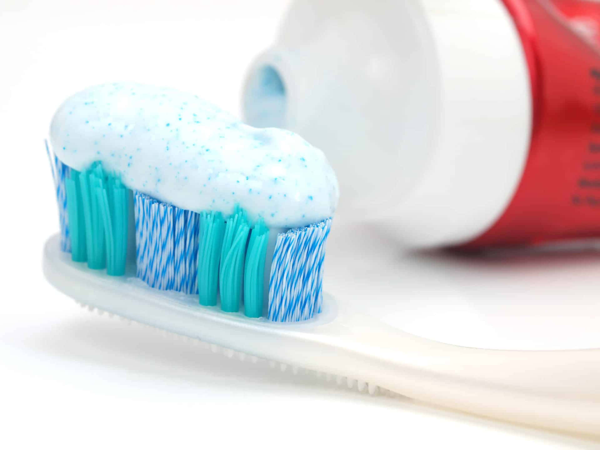 Toothpasteon Brushwith Tube Wallpaper