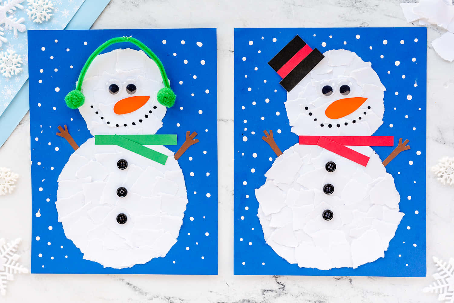 Two Snowman Crafts With Snowflakes On Them
