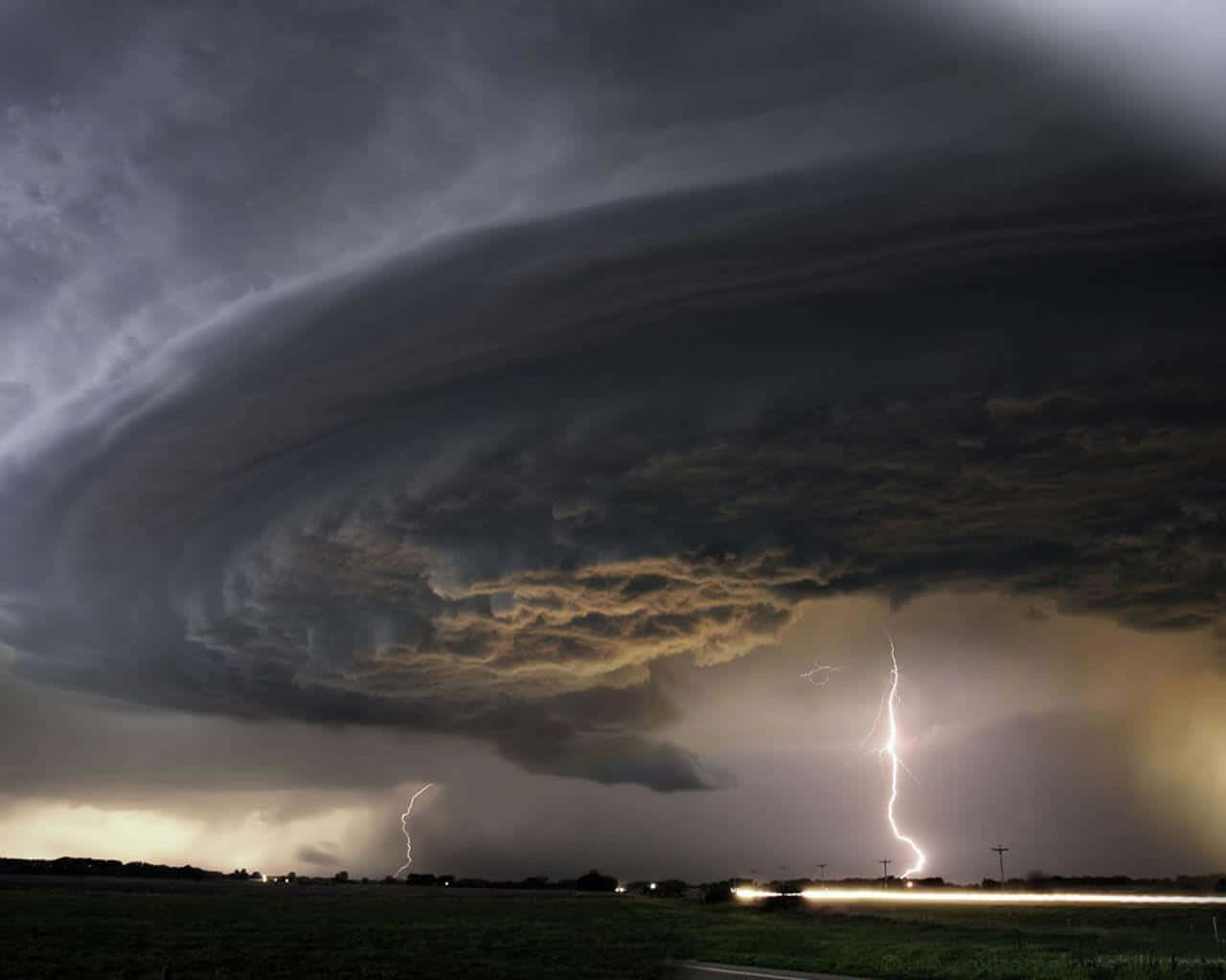 Powerful Tornado sweeping across a rural landscape