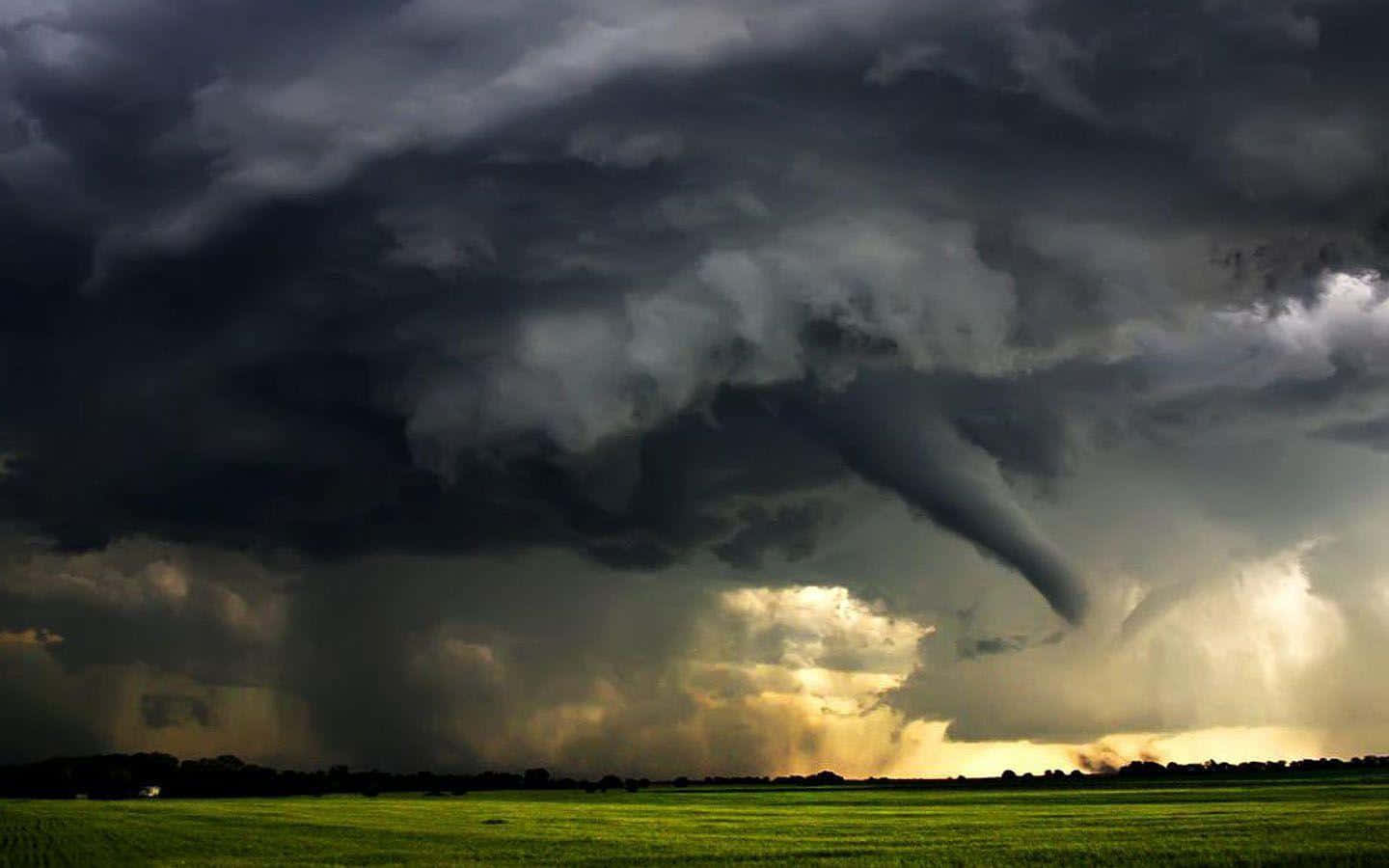 Powerful Tornado Sweeping across the Open Fields