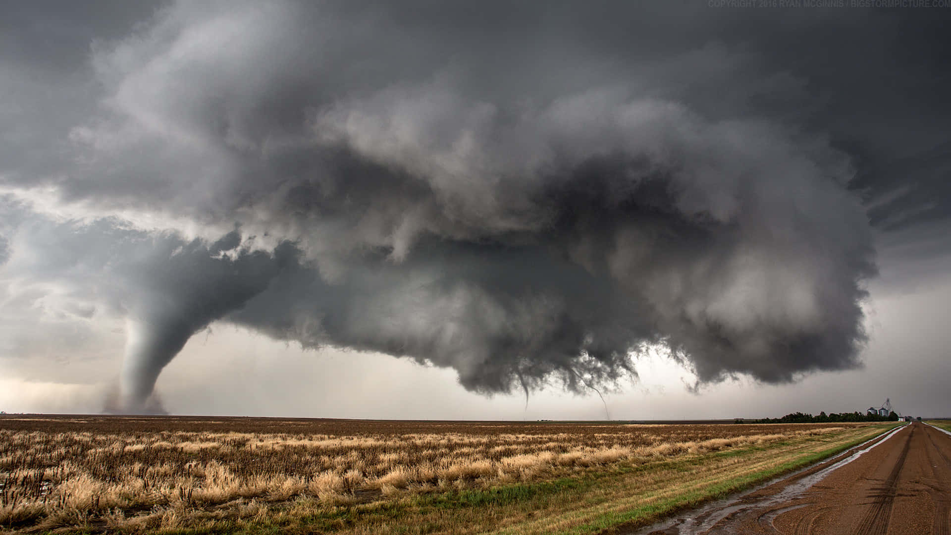 A powerful tornado sweeps across the vast landscape