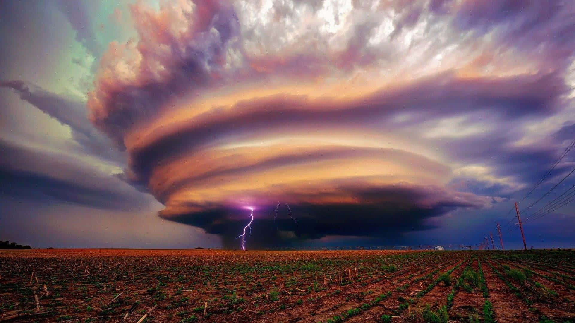 Powerful tornado sweeping across an open field