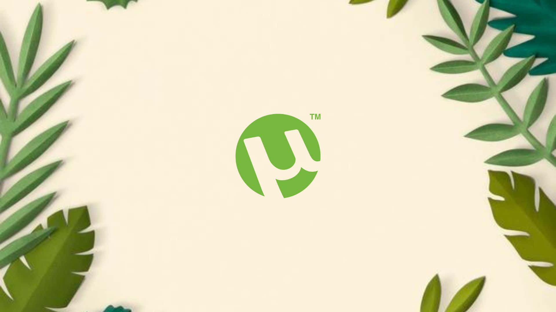 Et grønt logo med blade omkring det Wallpaper