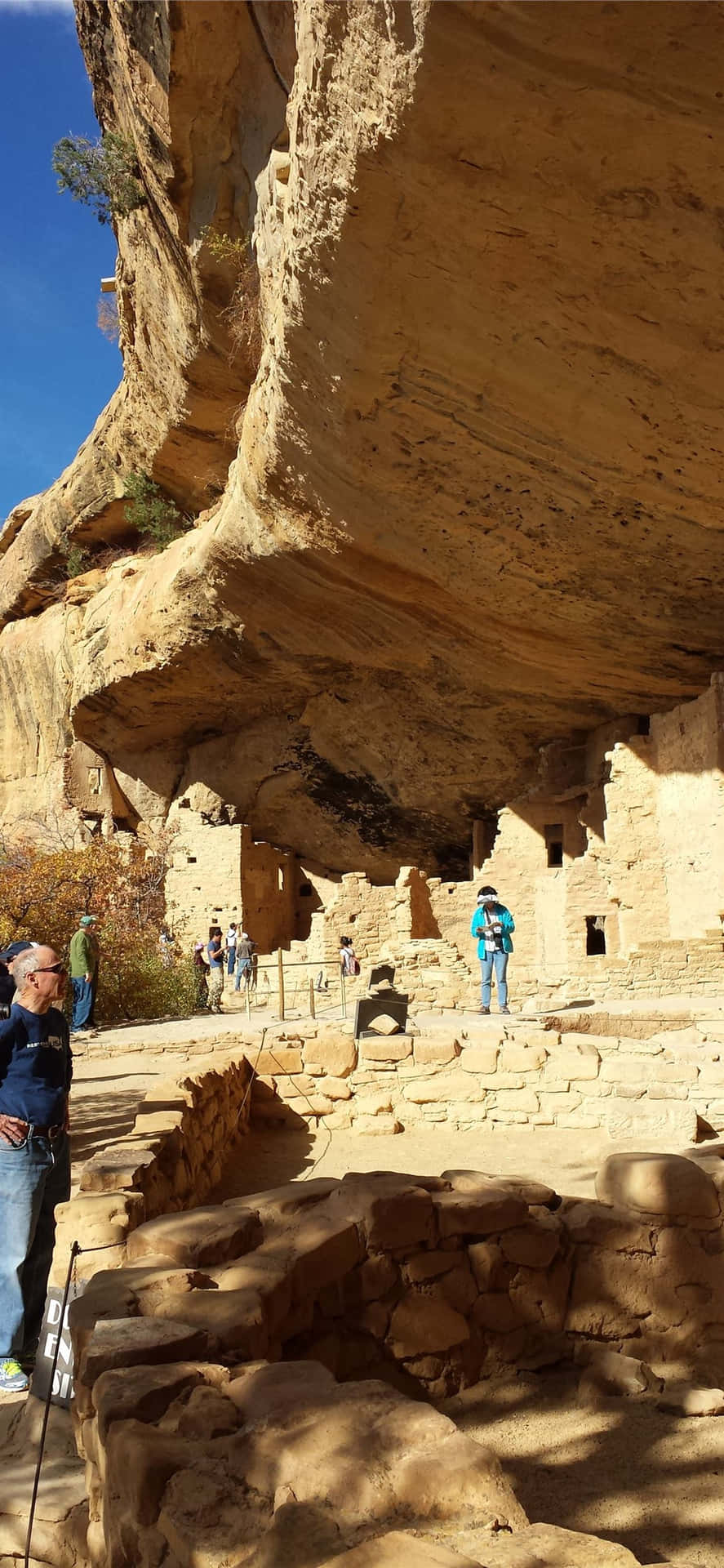 Tourist Exploring Mesa Verde National Park Wallpaper