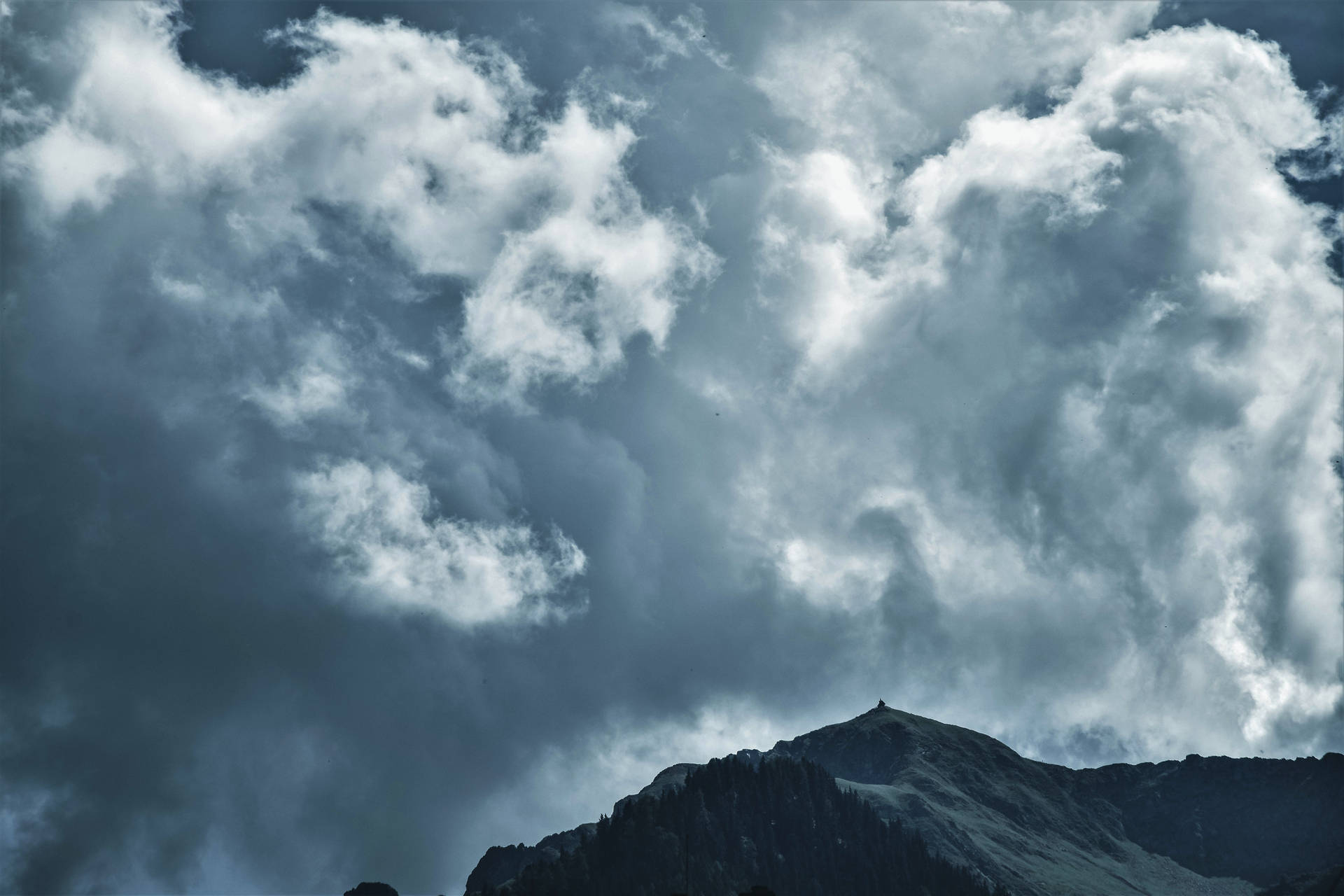 Towering Cumulonimbus Clouds Over Mountain Wallpaper