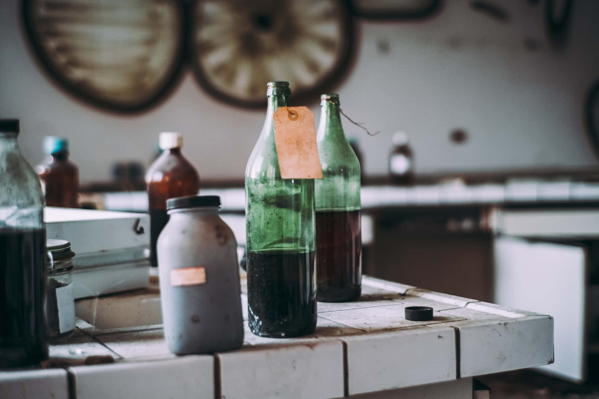 A Table With Bottles And Other Items On It Wallpaper