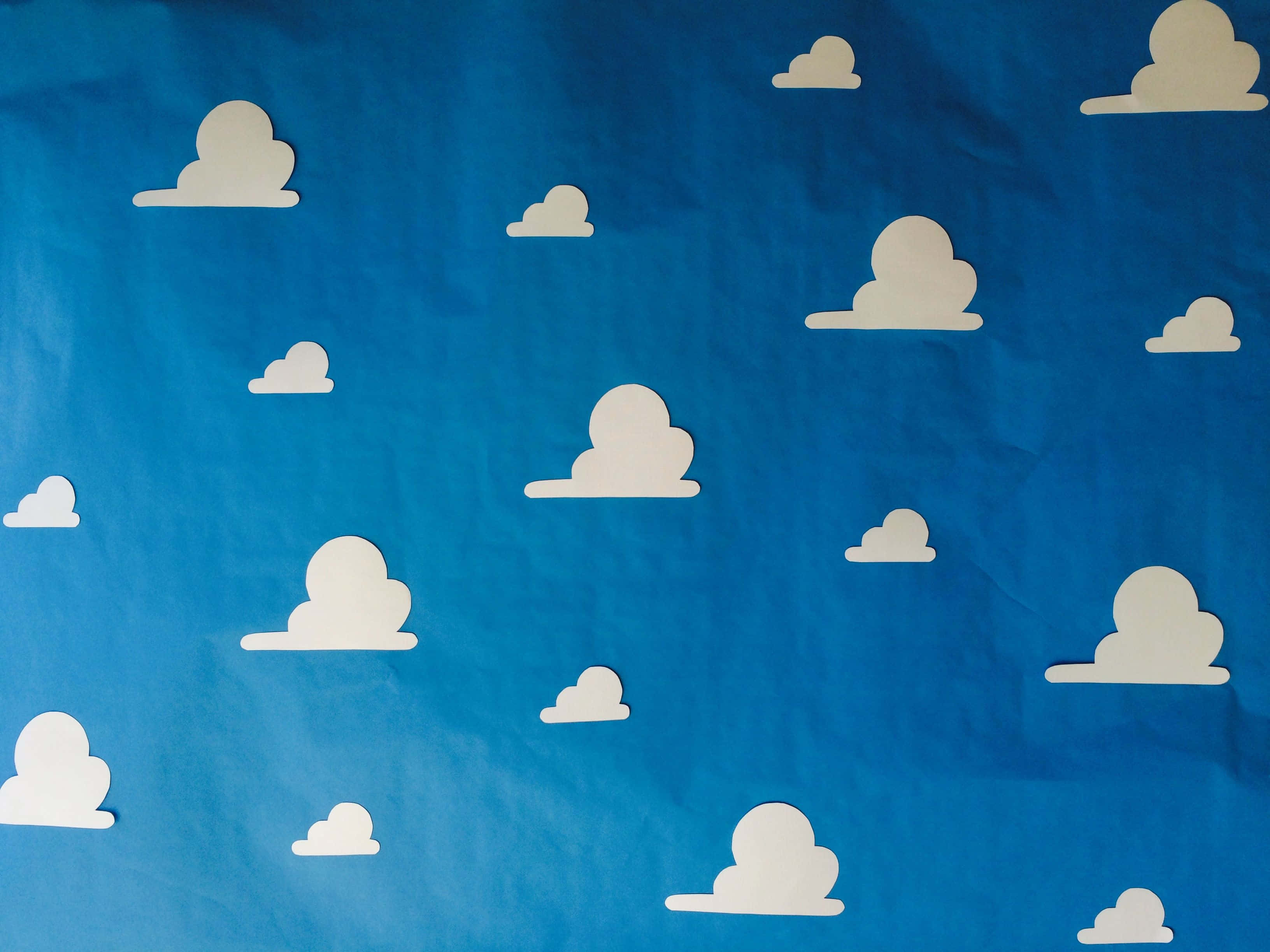 The magical world of Toy Story with a vibrant cloud background