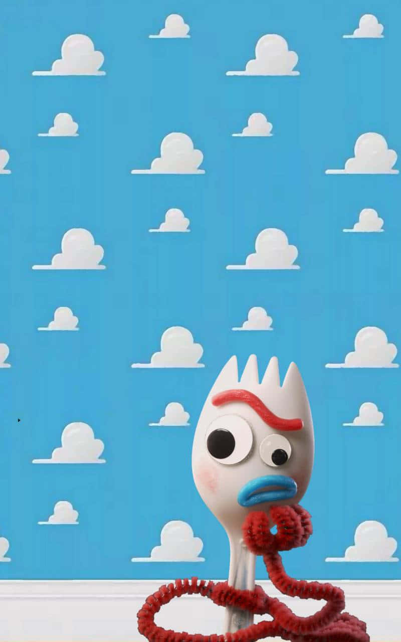 Forky Posing Against A Toy Story Cloud Wallpaper