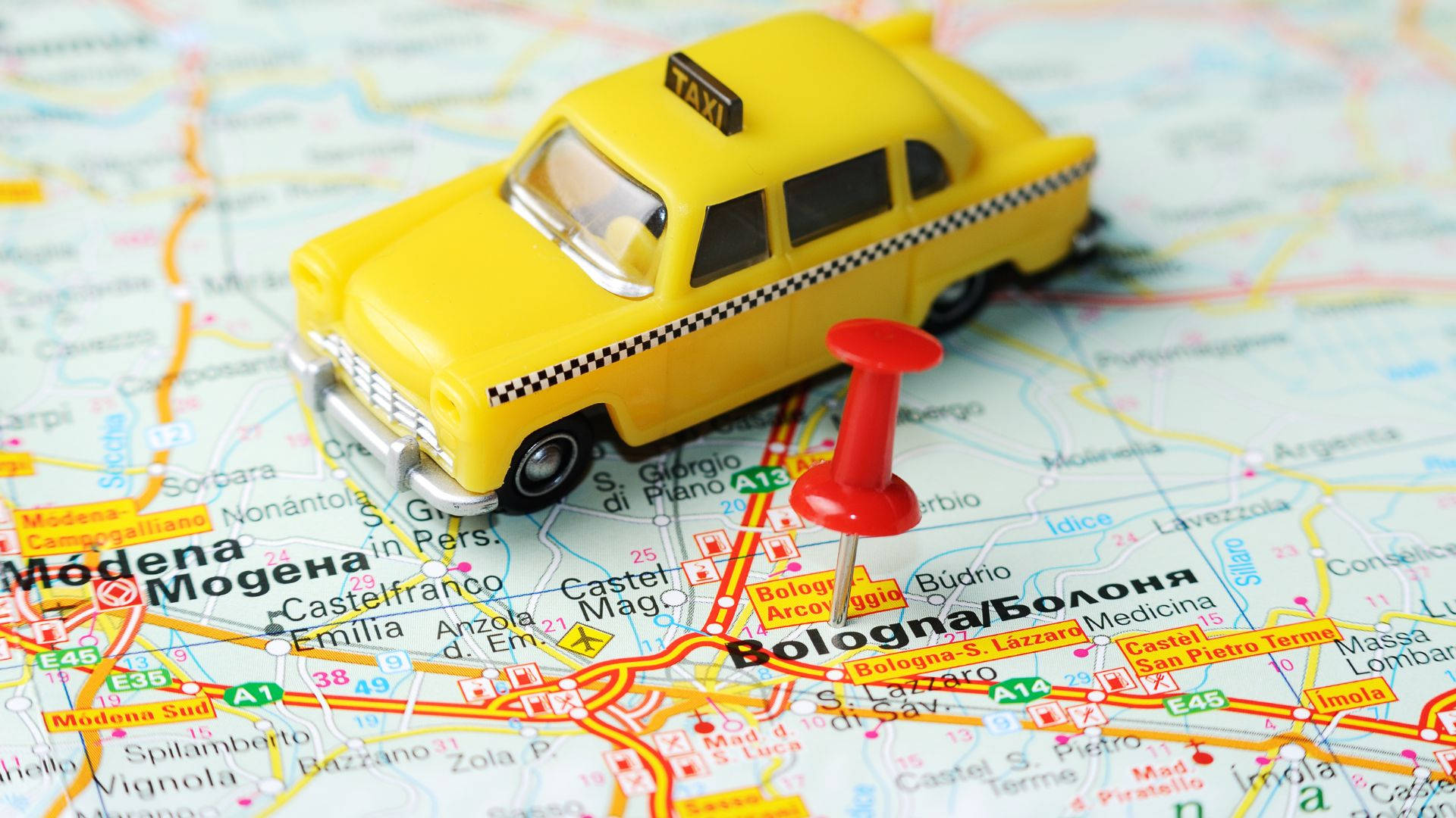 Toy Taxi On World Map Wallpaper