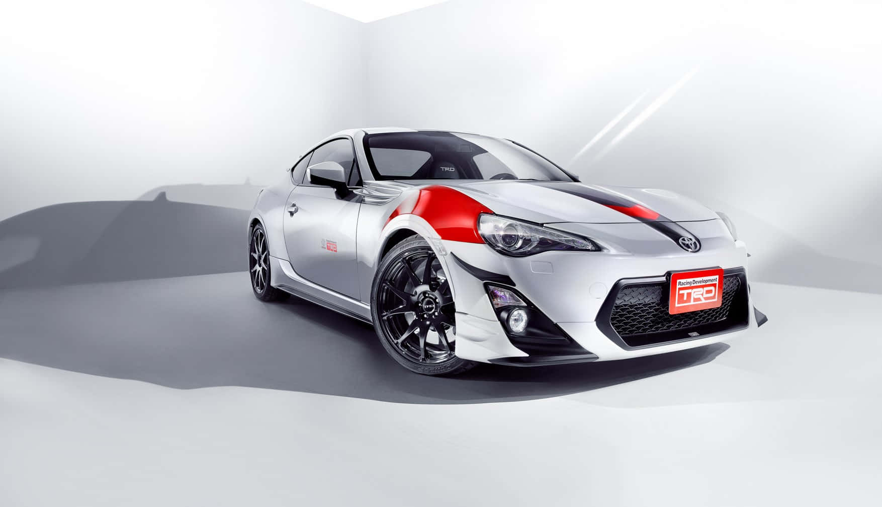 A Silver And Red Sports Car Is Shown In A Studio Wallpaper