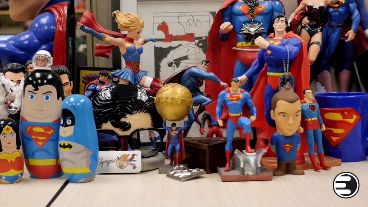 A Group Of Superman Figurines On A Table
