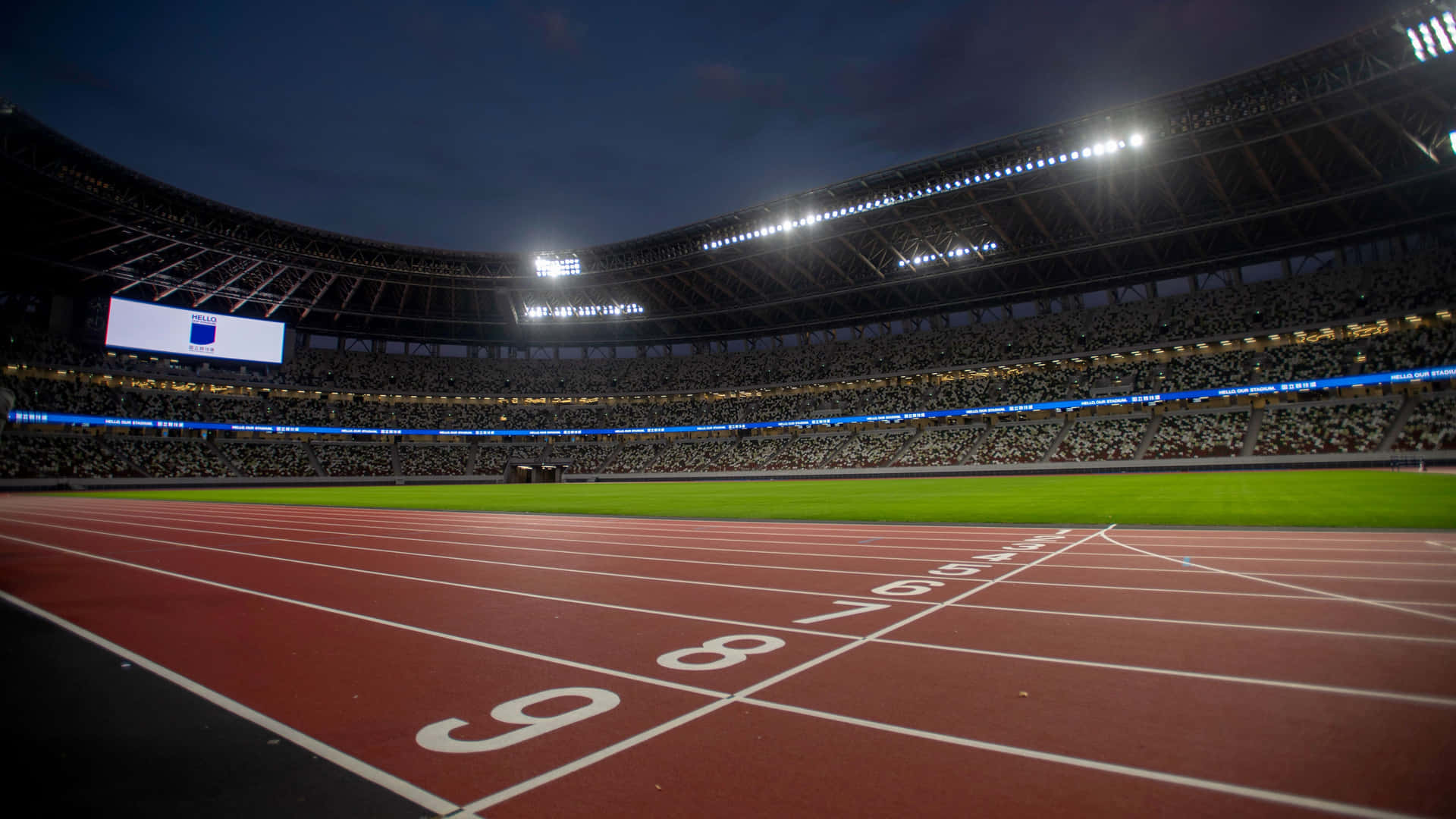 A Stadium With A Track And Lights