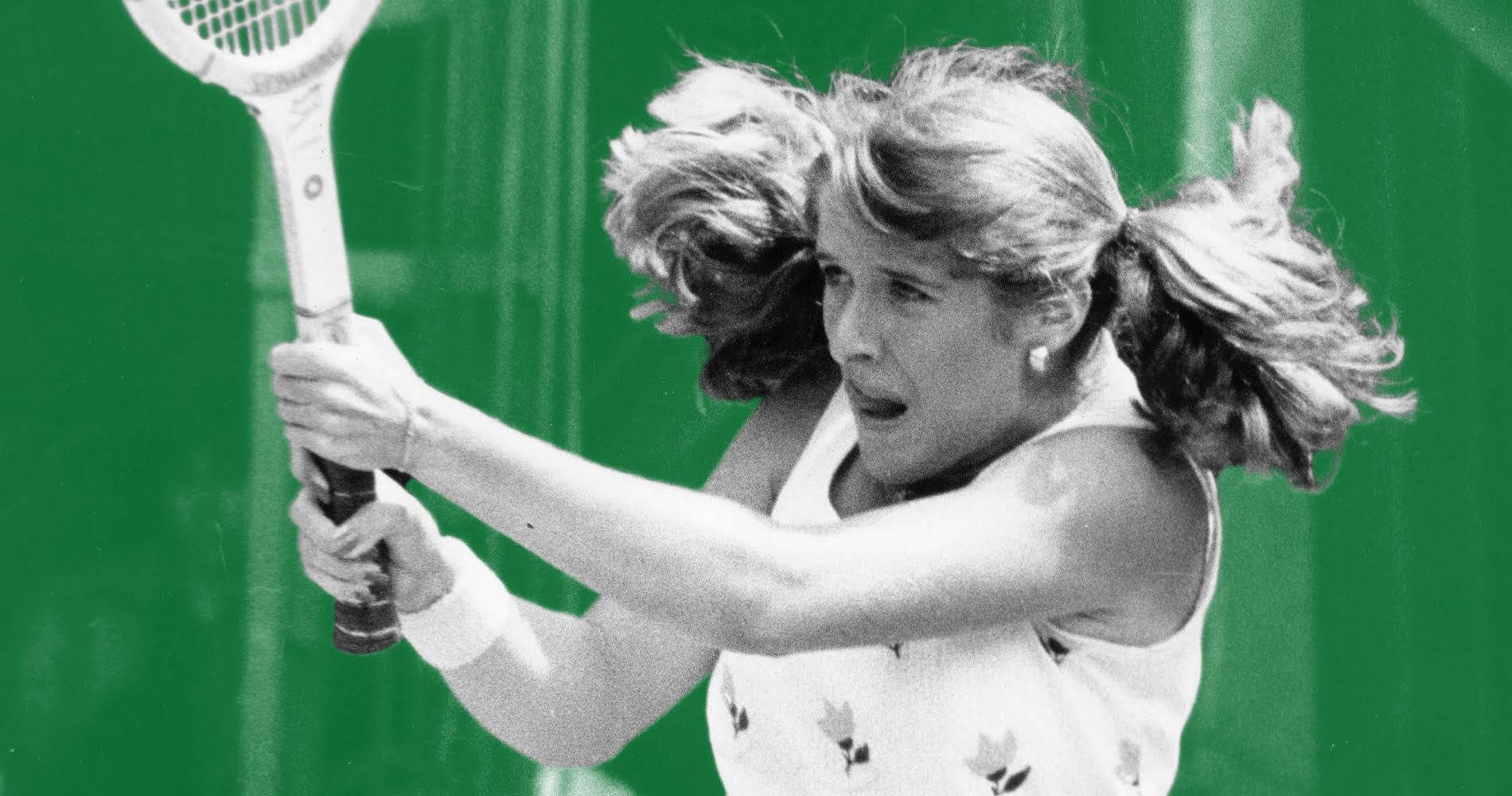 Caption: Tennis legend Tracy Austin against a striking green backdrop. Wallpaper