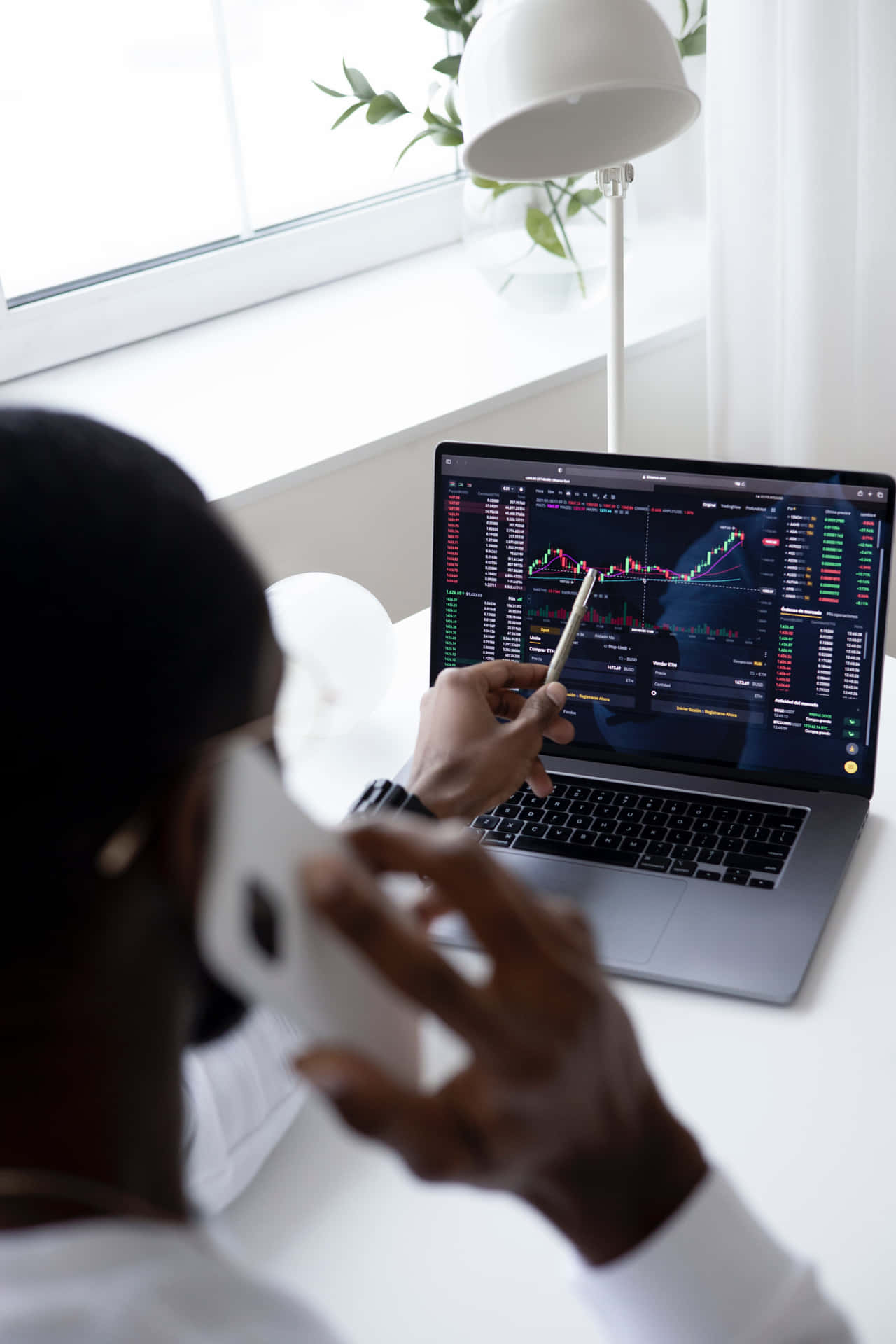 Trader Analyzing Stock Marketon Laptop Wallpaper