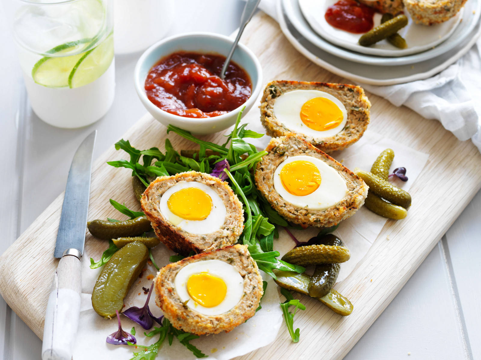 Traditional British Scotch Eggs Dish With Pickles And Vegetables Wallpaper