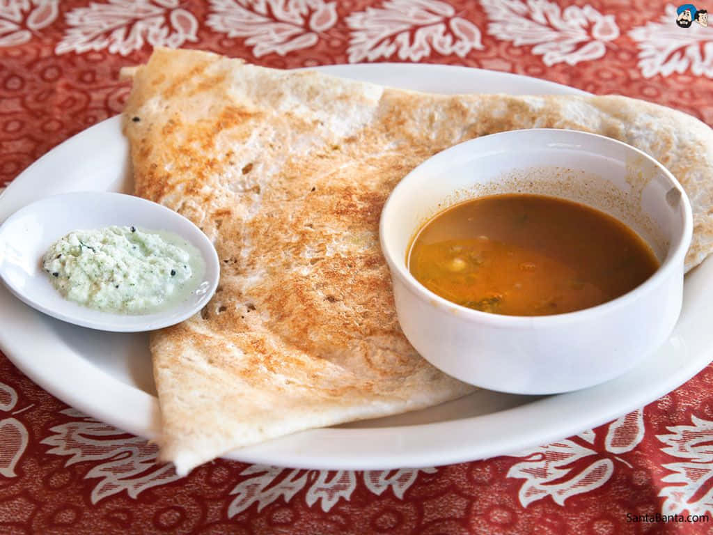 Traditional Indian Dosa With Chutney And Sambar Wallpaper