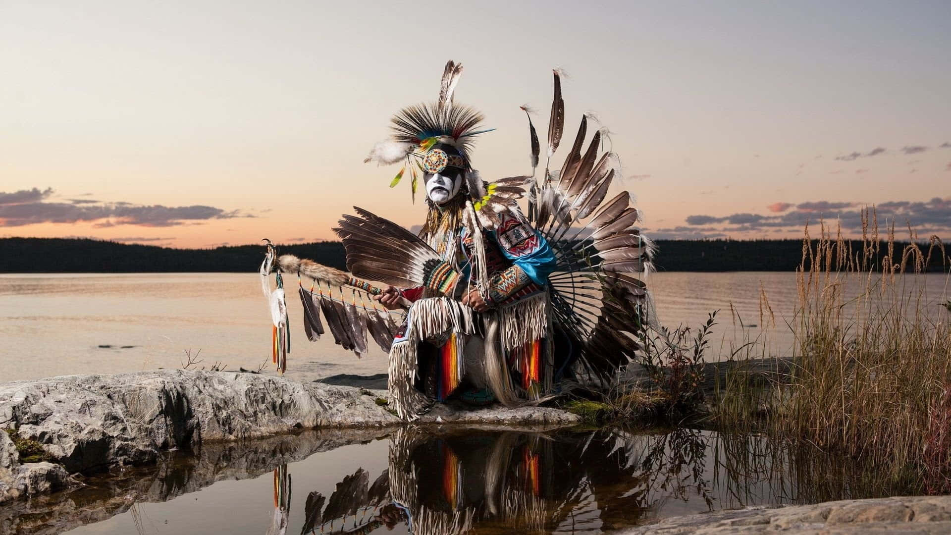 Caption: Majestic Native Warrior by the Lake Wallpaper