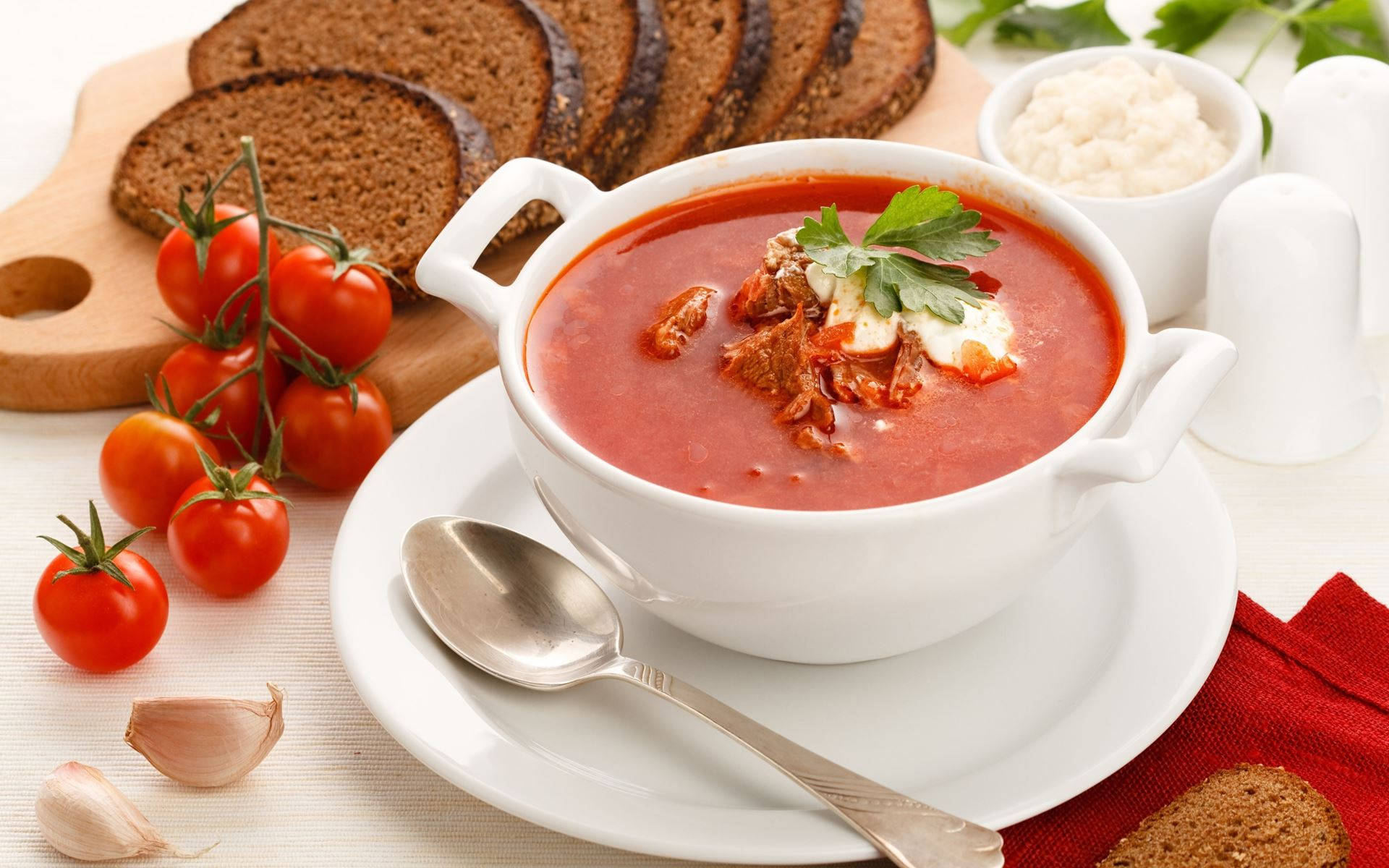 Rich and hearty traditional Ukrainian Borscht Soup on a rustic wooden table. Wallpaper