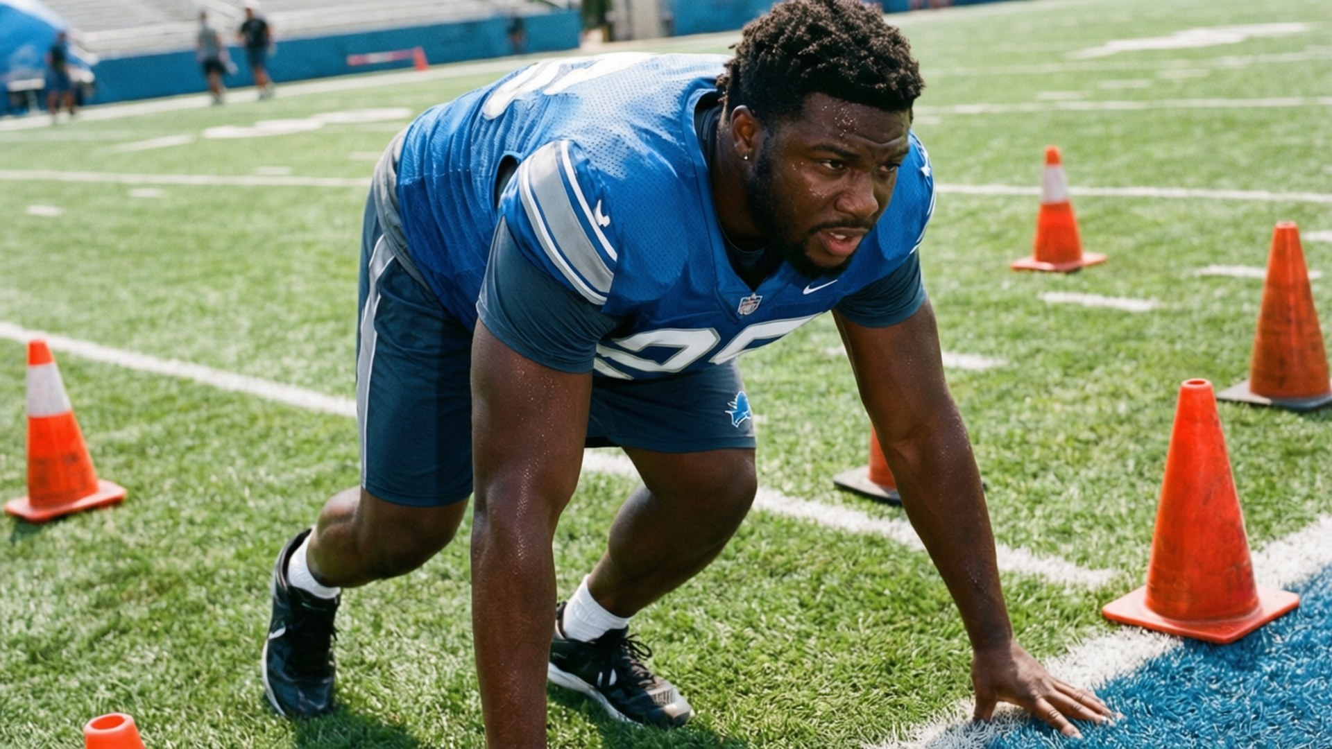 Jameson Williams explodes out of a stance during a training drill.