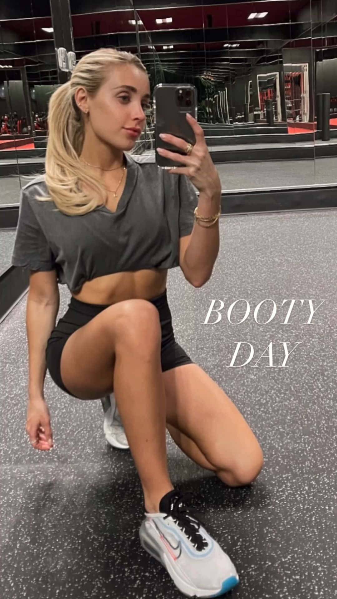 A Woman Is Taking A Selfie In A Gym Wallpaper