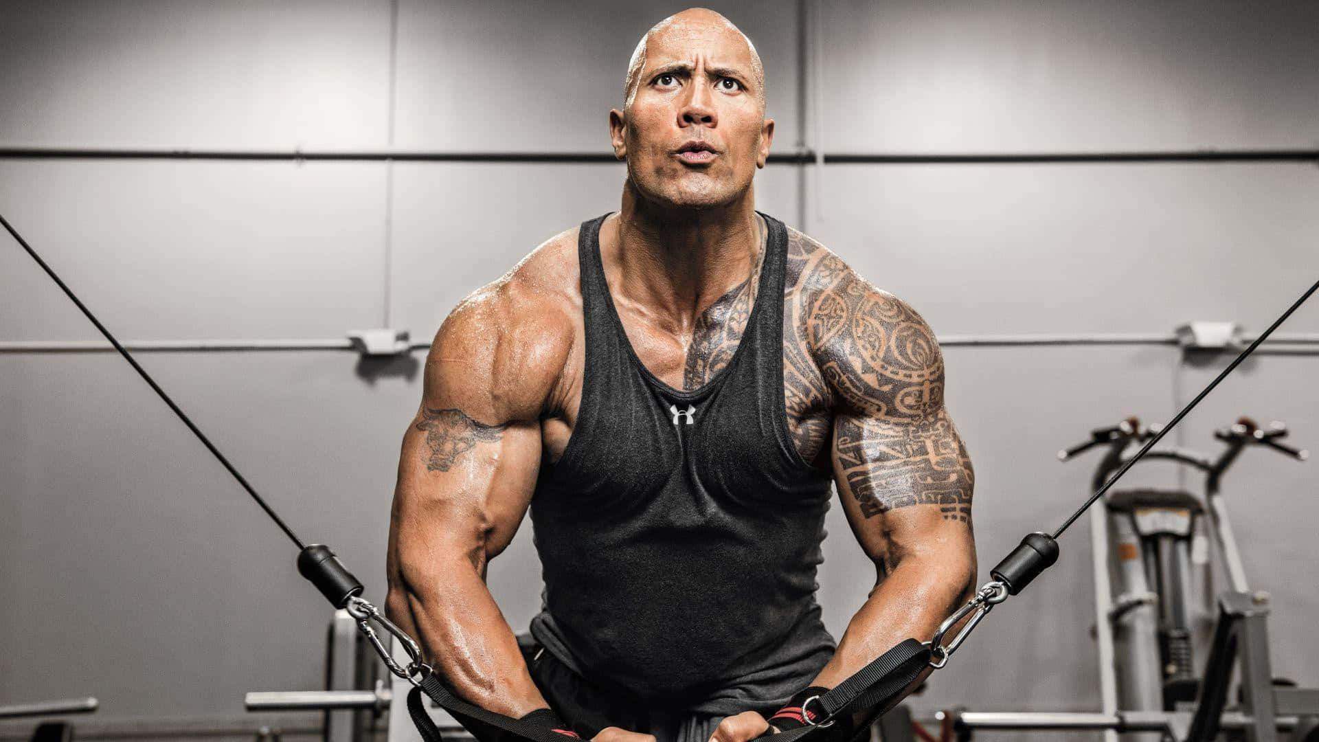 The Rock Is Doing A Pull Up In The Gym