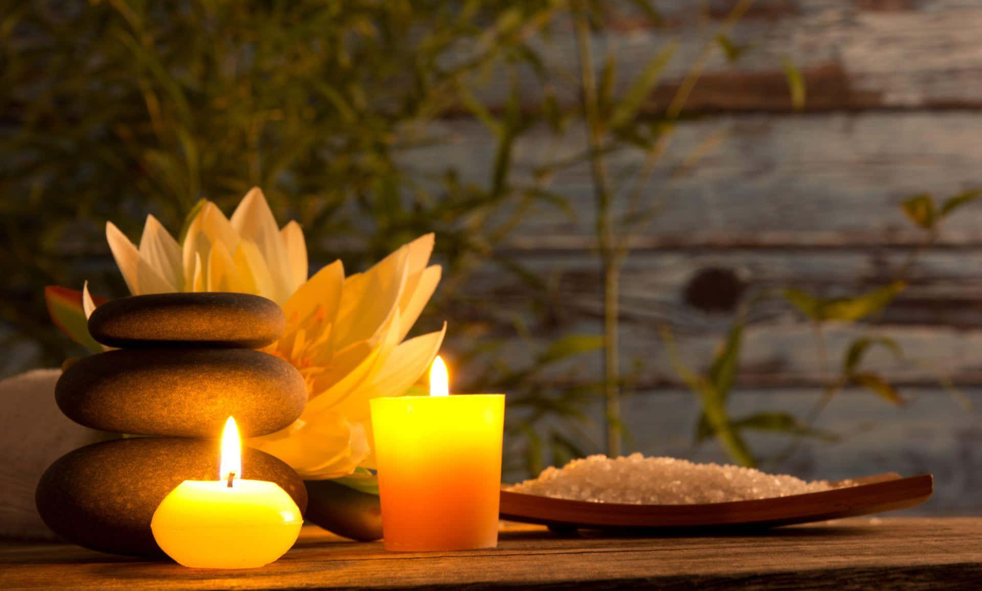 Tranquil Spa Settingwith Candlesand Stones Wallpaper
