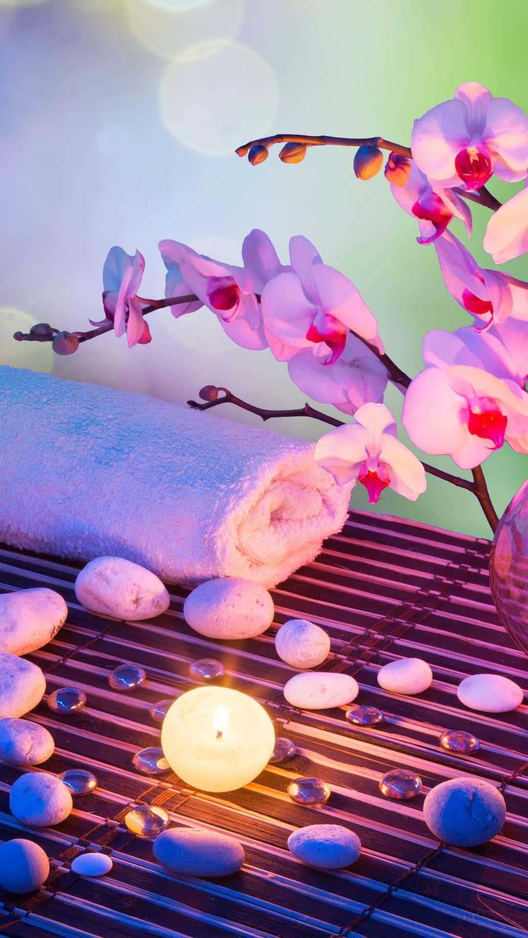 Tranquil Spa Settingwith Orchidsand Candle Wallpaper