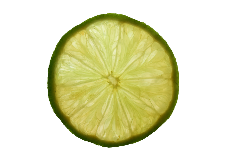 Translucent Lemon Slice PNG — A vibrant cross-section of a lime reveals its juicy segments and green rind against a stark black background.