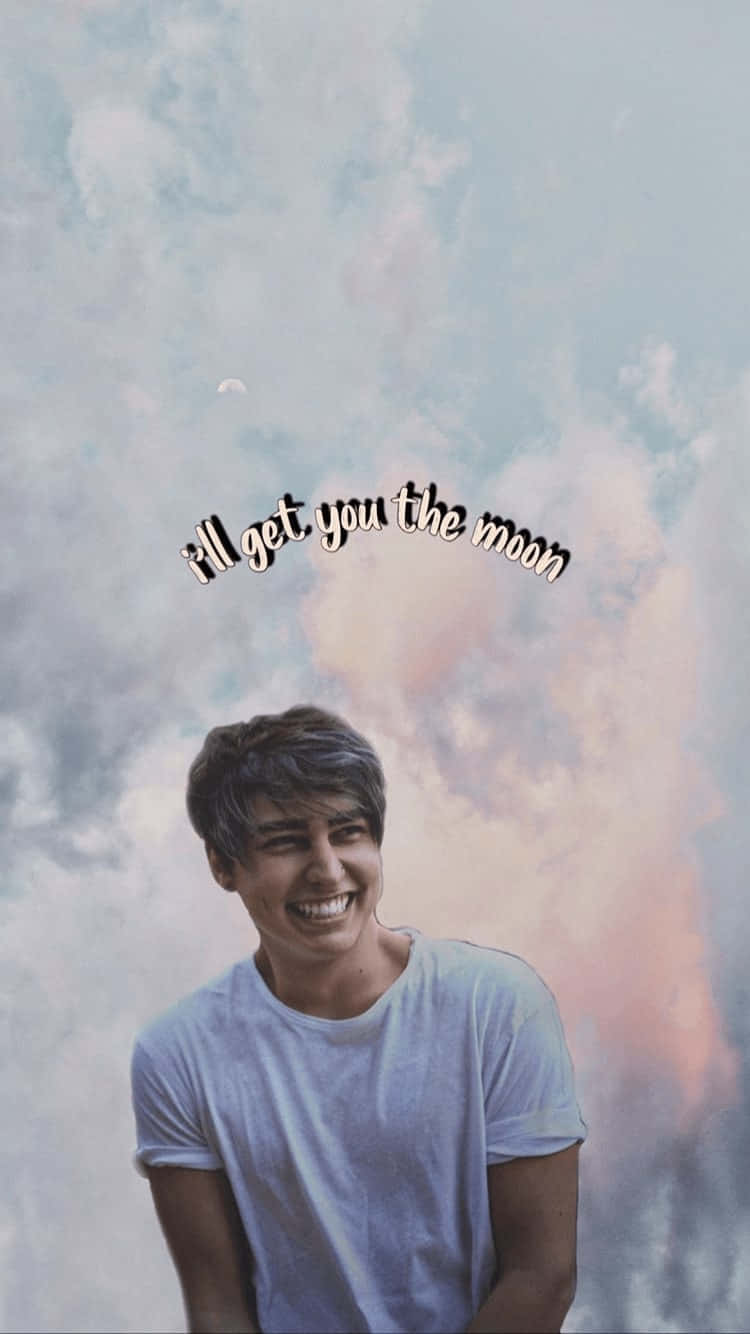 A Man Smiling With The Words'all Got You The Moon' Wallpaper