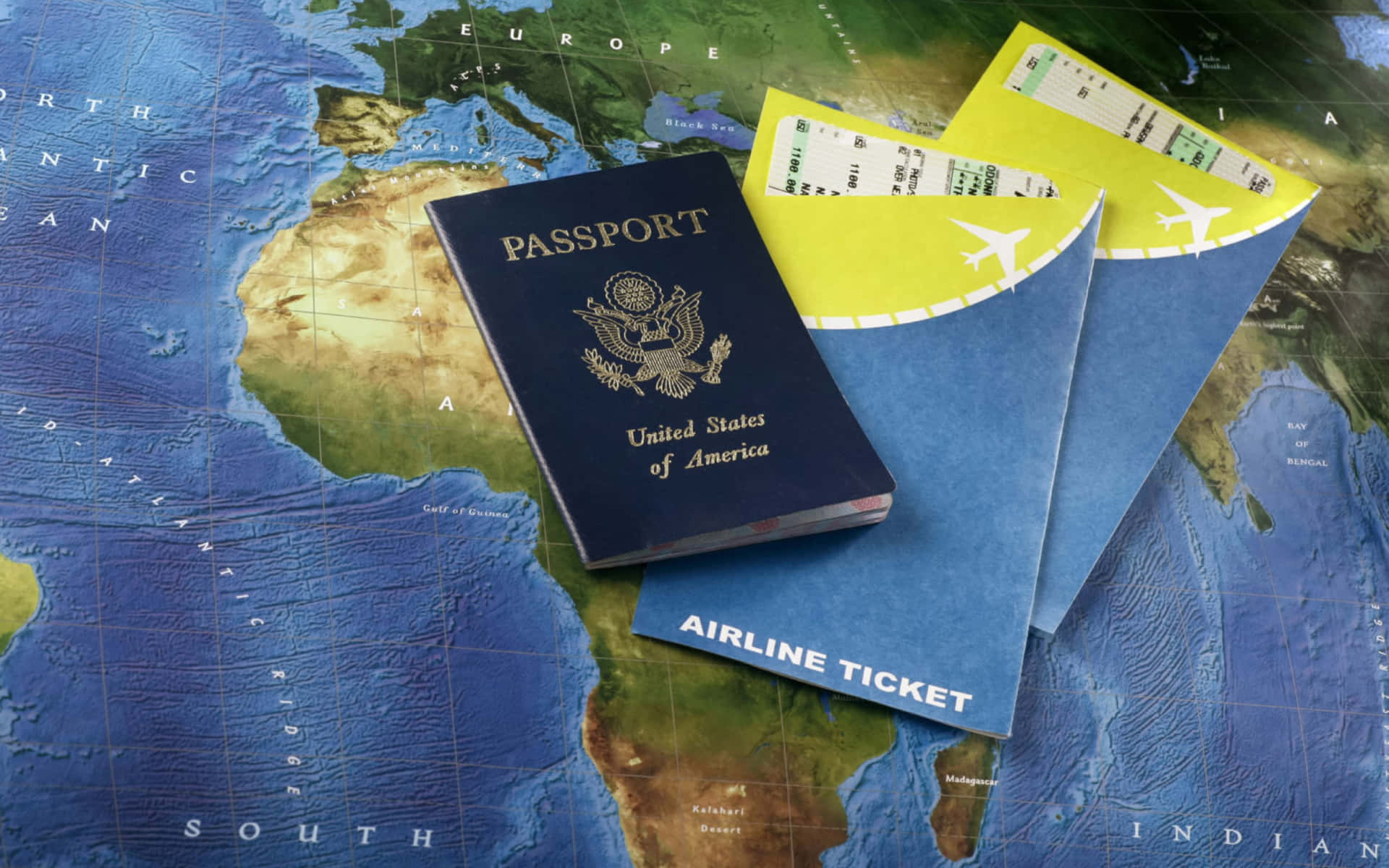 A Passport And A Ticket On A Map Wallpaper