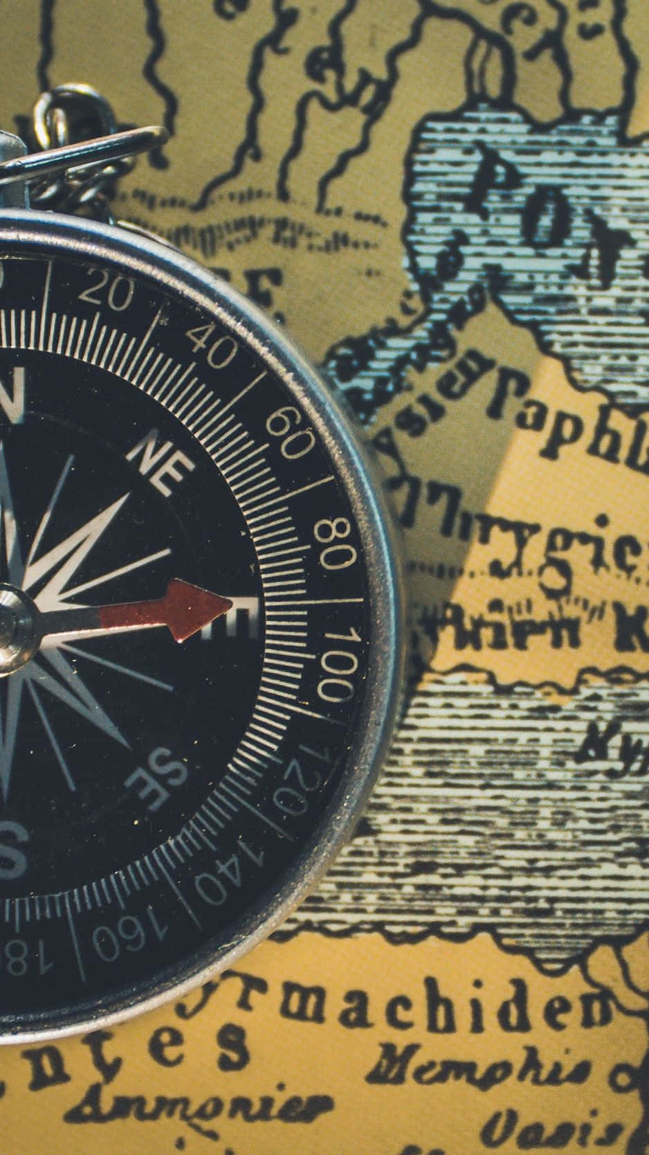 A Compass On A Map Wallpaper