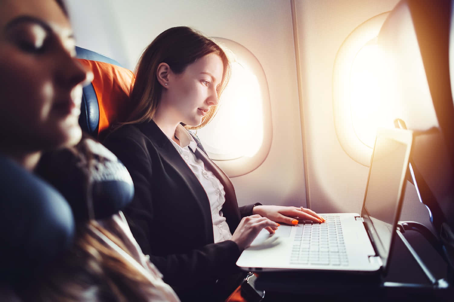 Picture Of Travelling Woman On An Airplane Wallpaper