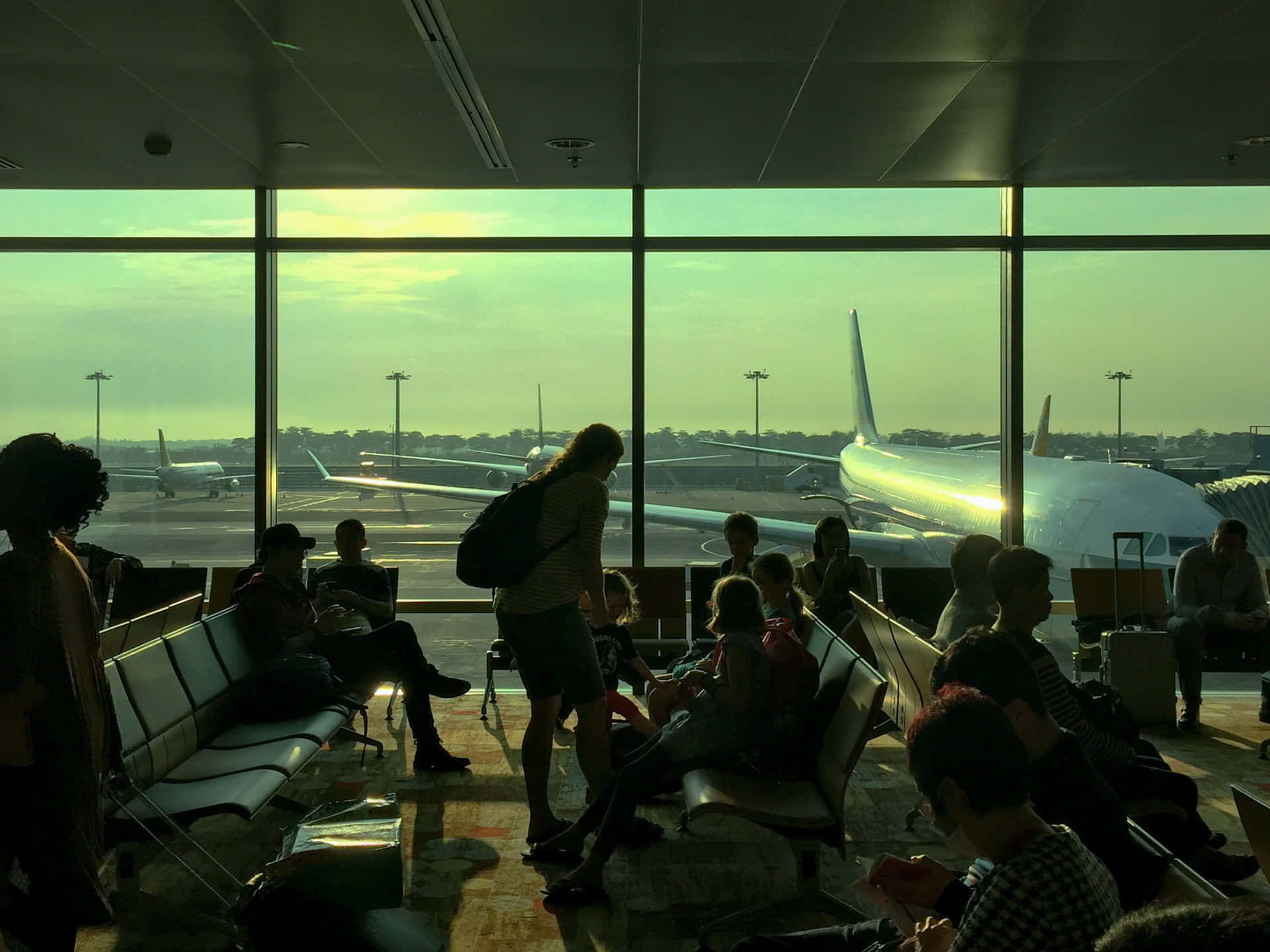 Picture Of People Traveling In Airport Wallpaper