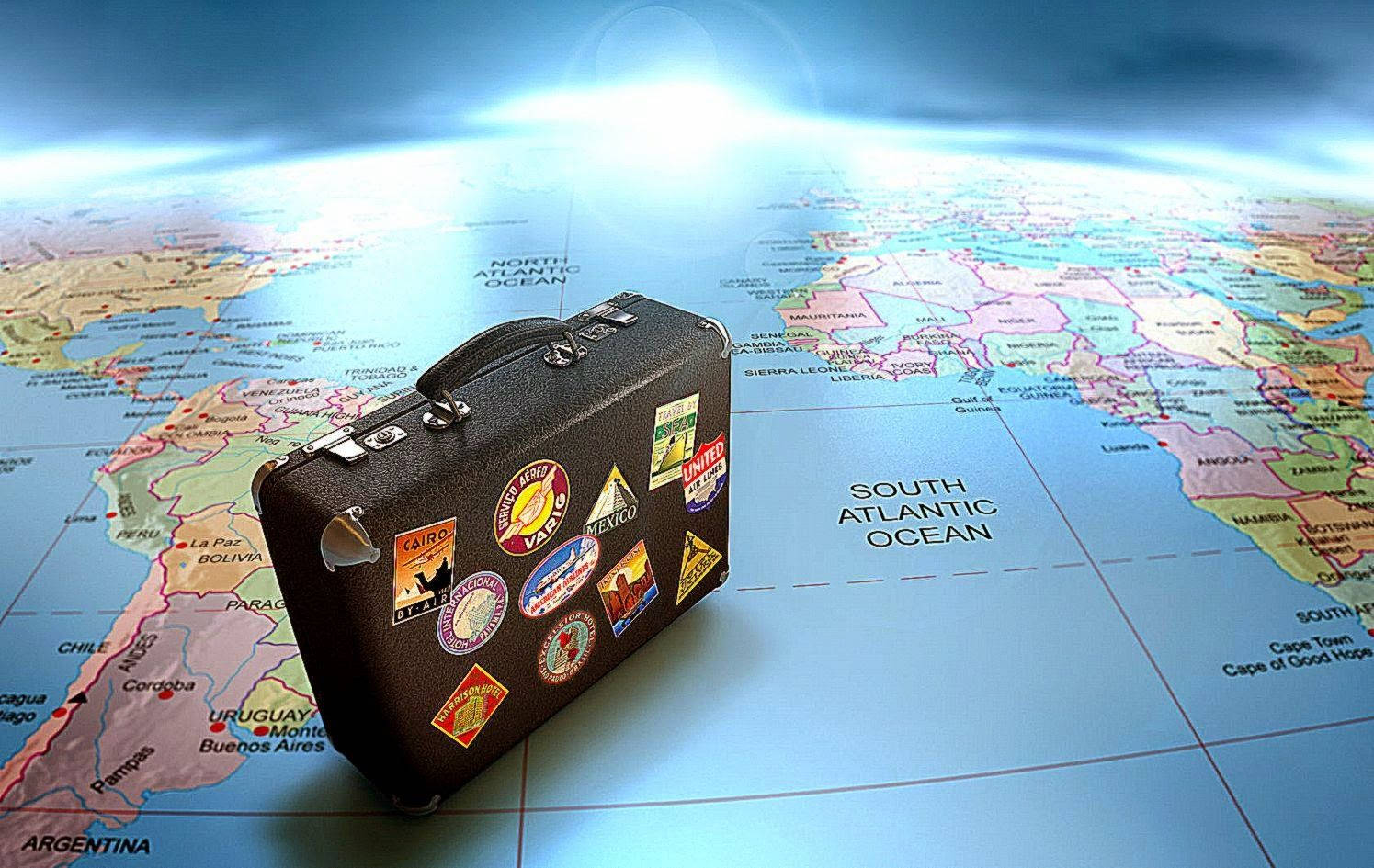 A Suitcase On A Map Wallpaper