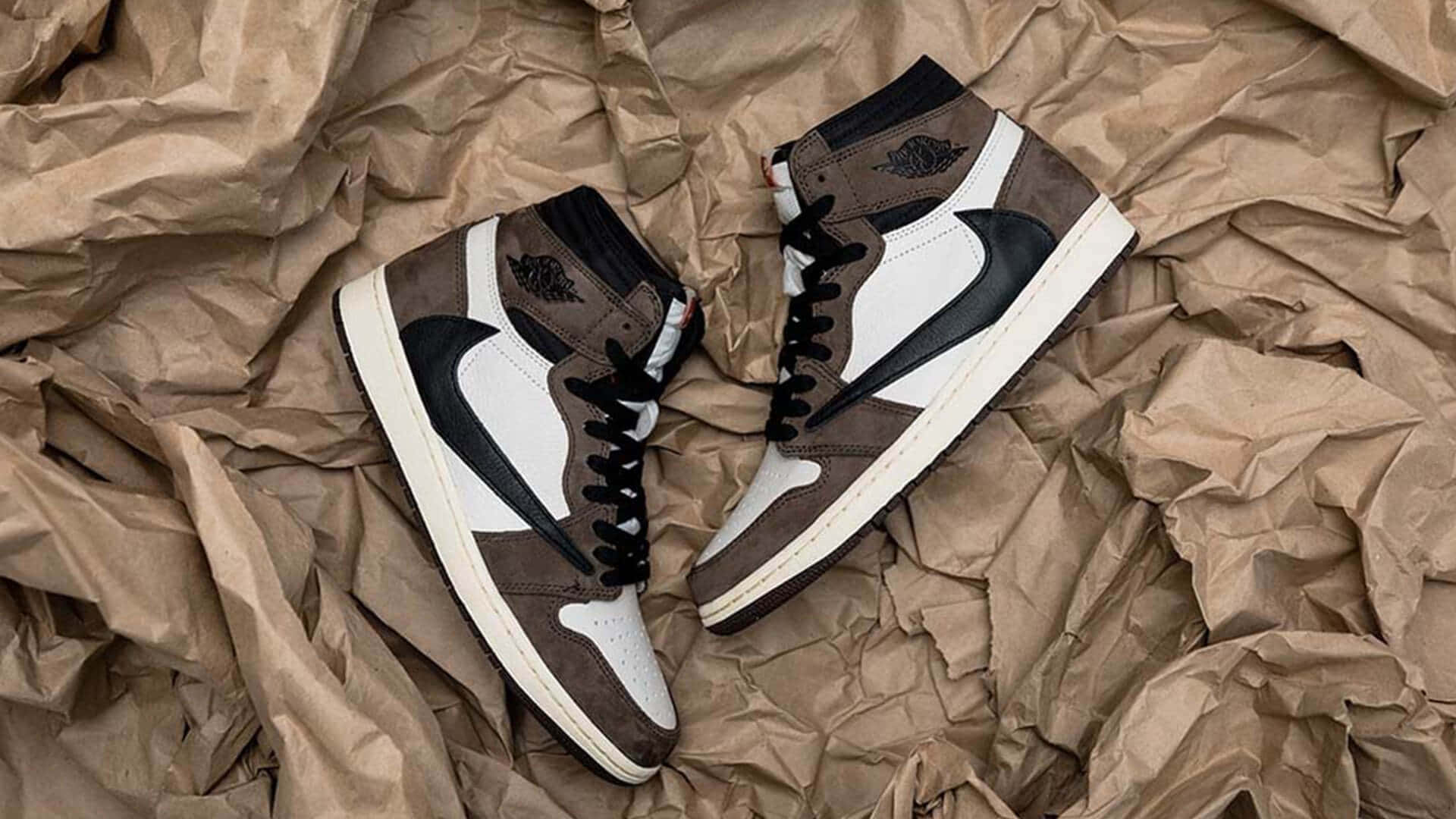 Uniting Music And Style - A Look At Travis Scott's Jordan 1 Sneakers Wallpaper